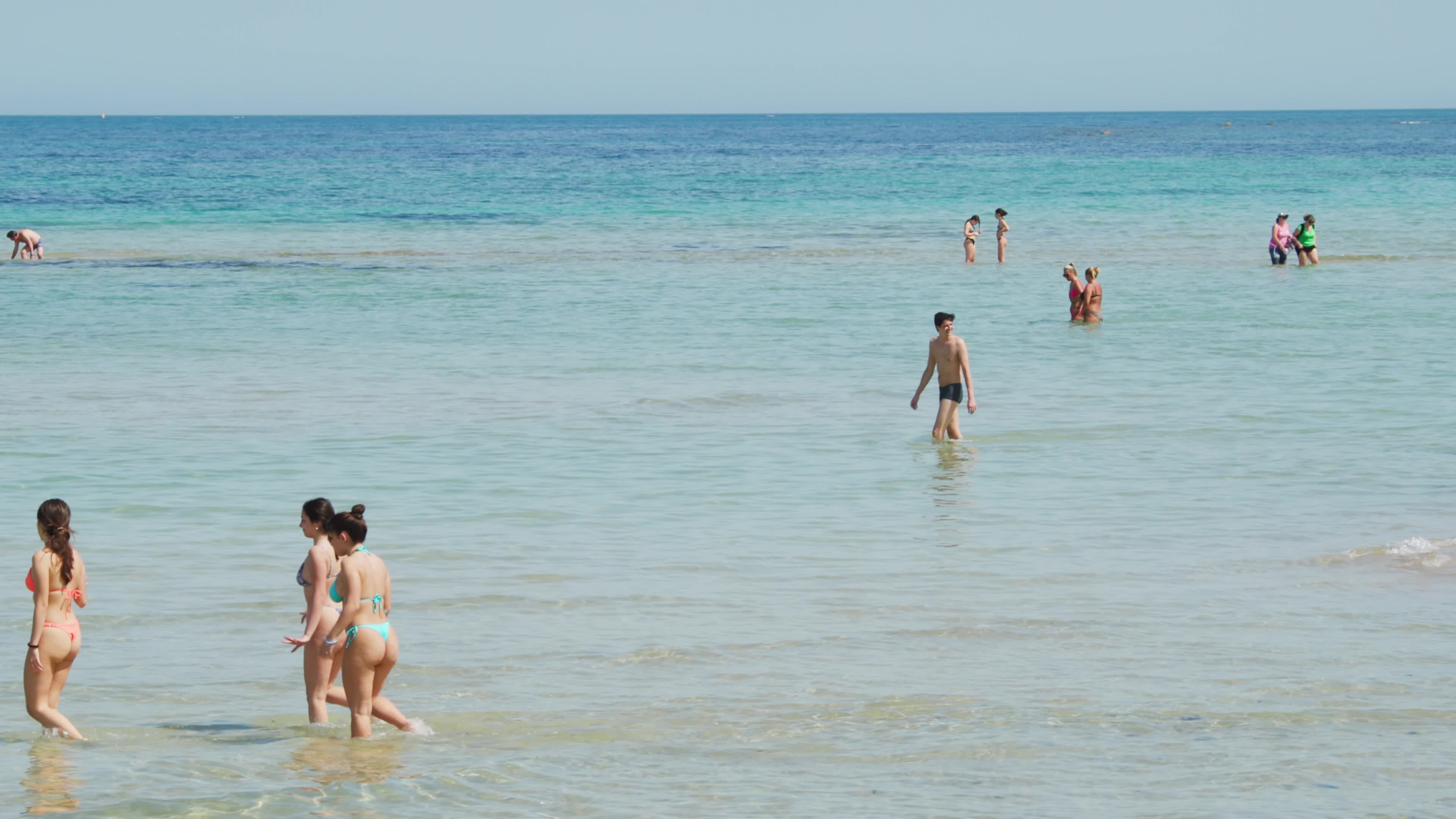 People at the Beach in Italy Amid Above-Normal Temperatures in April