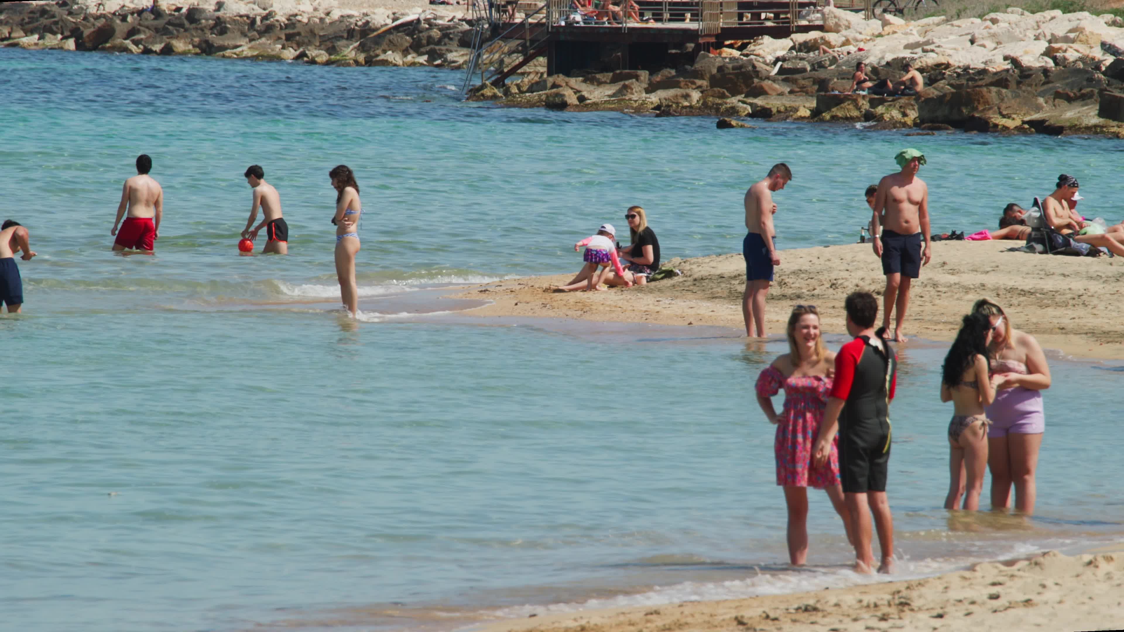 People at the Beach in Italy Amid Above-Normal Temperatures in April