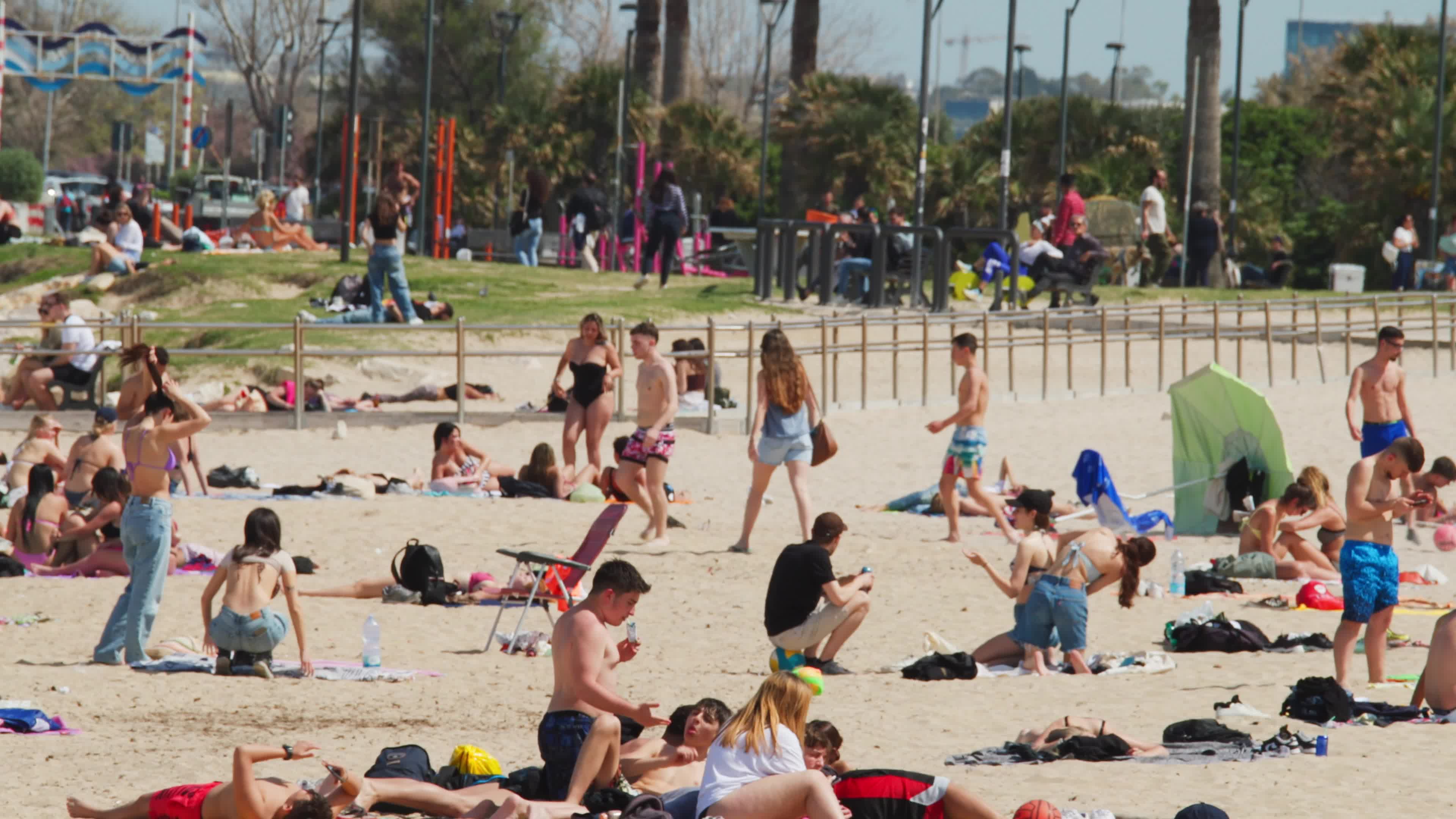 People at the Beach in Italy Amid Above-Normal Temperatures in April