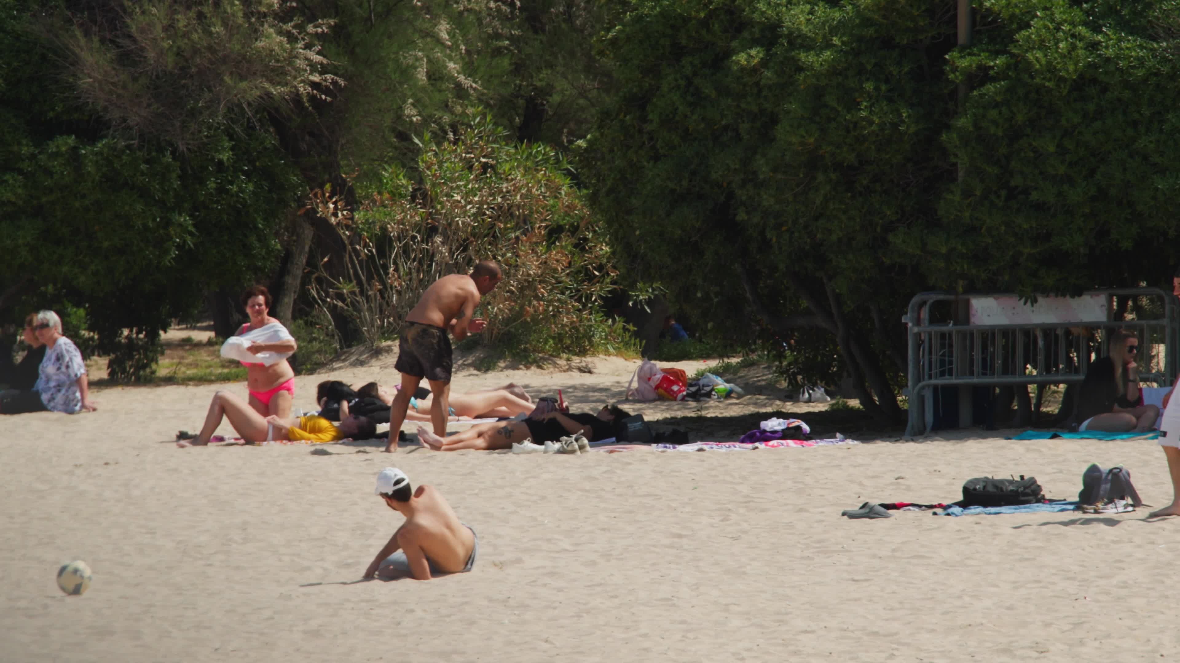 People at the Beach in Italy Amid Above-Normal Temperatures in April