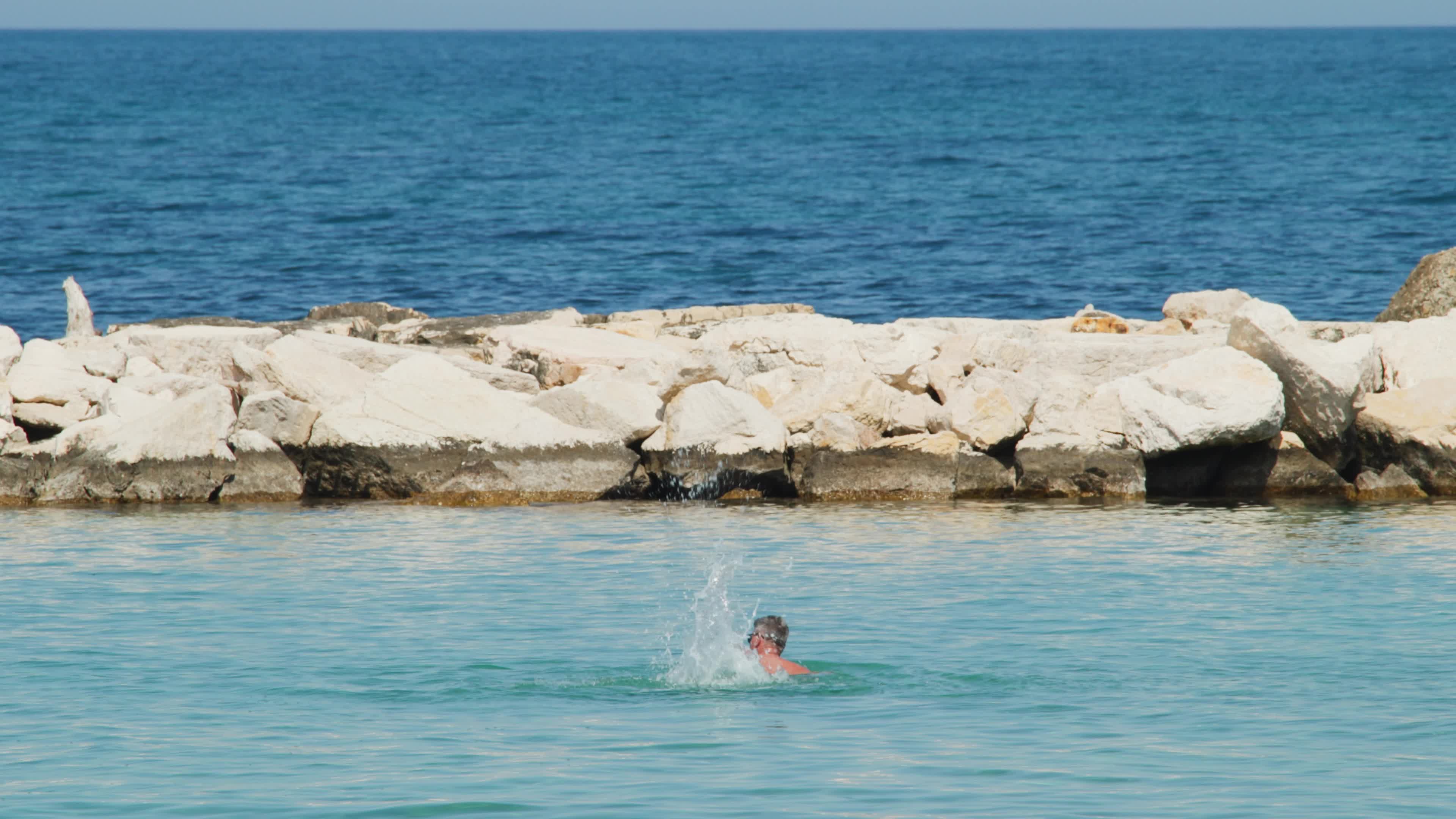 People at the Beach in Italy Amid Above-Normal Temperatures in April