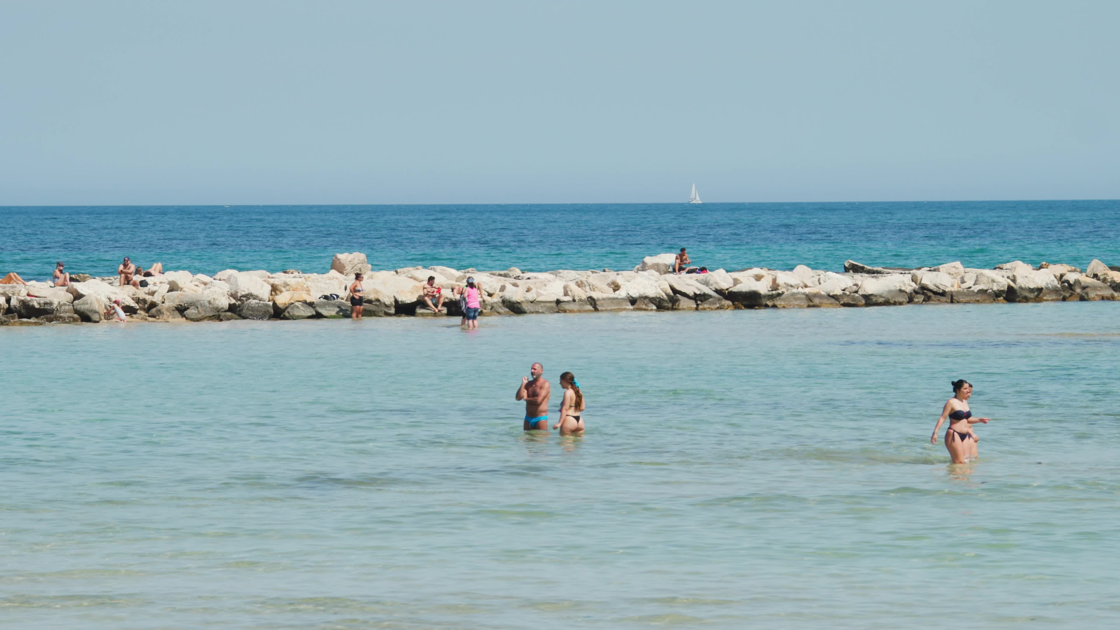 People at the Beach in Italy Amid Above-Normal Temperatures in April
