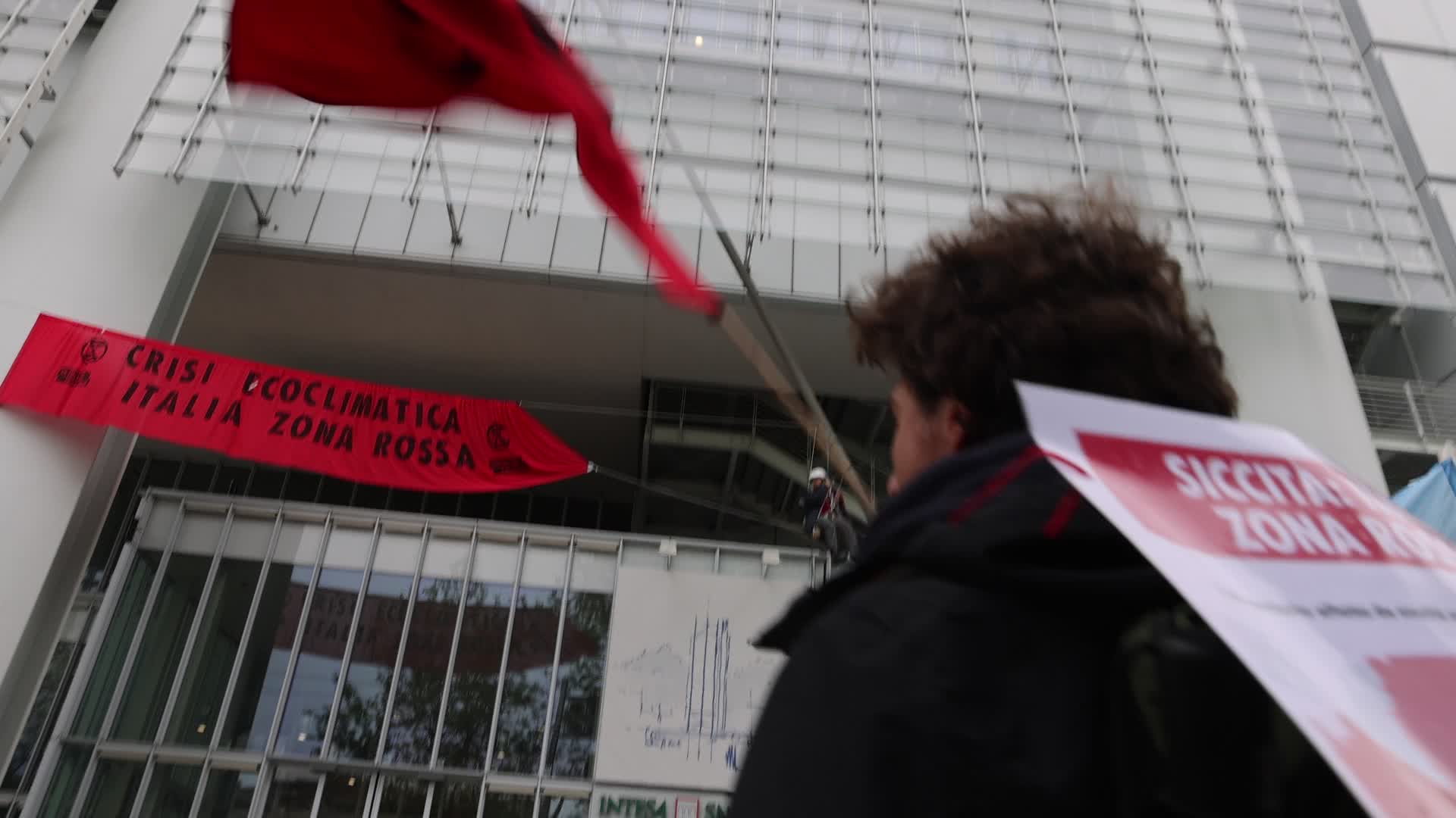 Activists from Extinction Rebellion (XR) protested at the Intesa Sanpaolo skyscraper