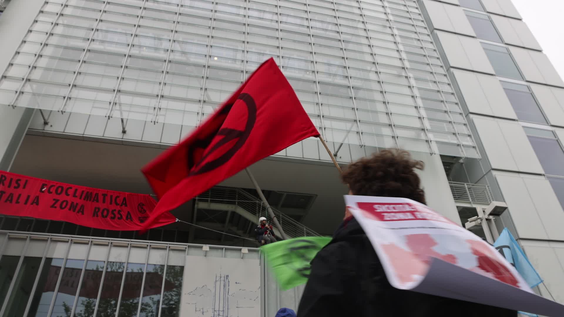 Activists from Extinction Rebellion (XR) protested at the Intesa Sanpaolo skyscraper