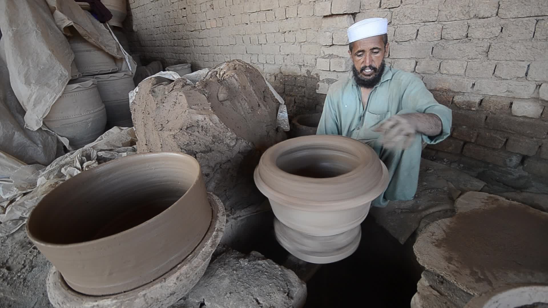 Laborers work on the eve of World Labor Day in Peshawar 