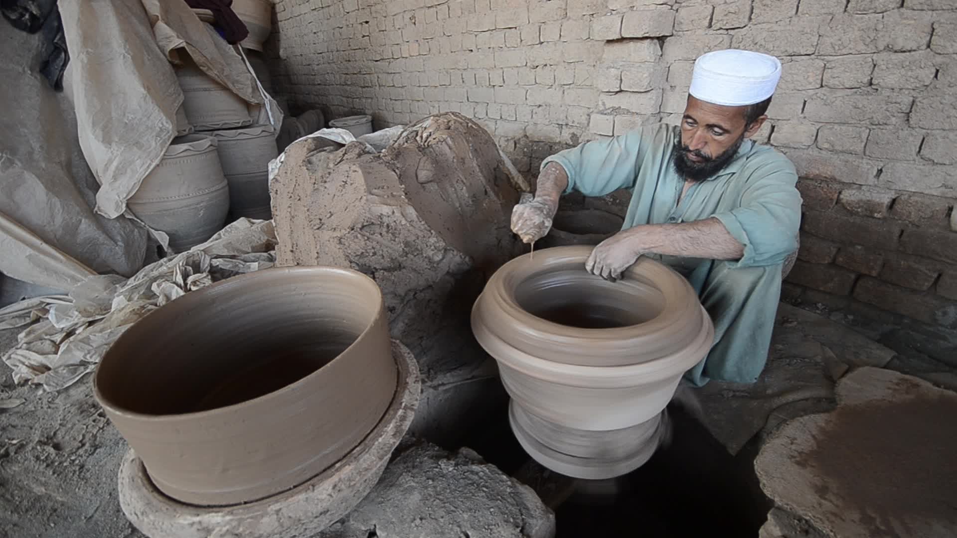 Laborers work on the eve of World Labor Day in Peshawar 