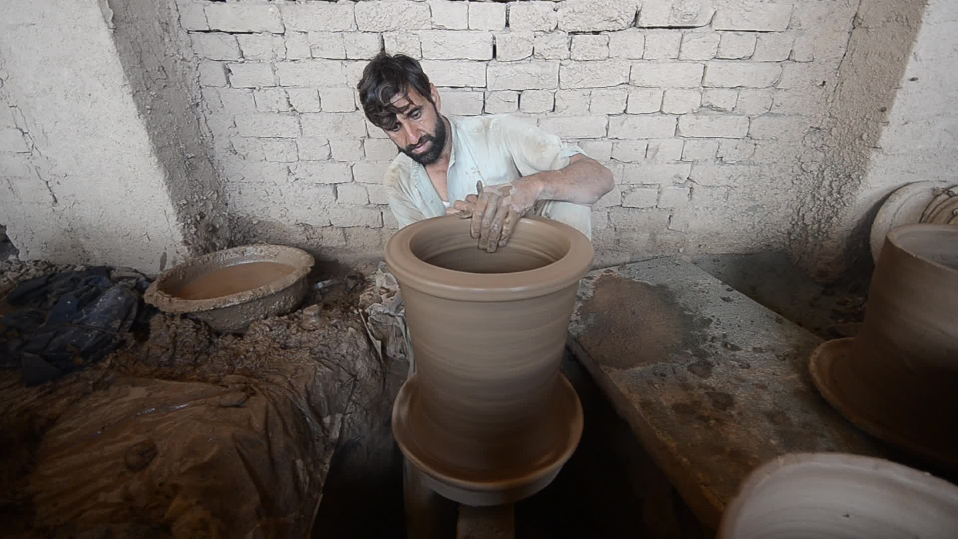 Laborers work on the eve of World Labor Day in Peshawar 
