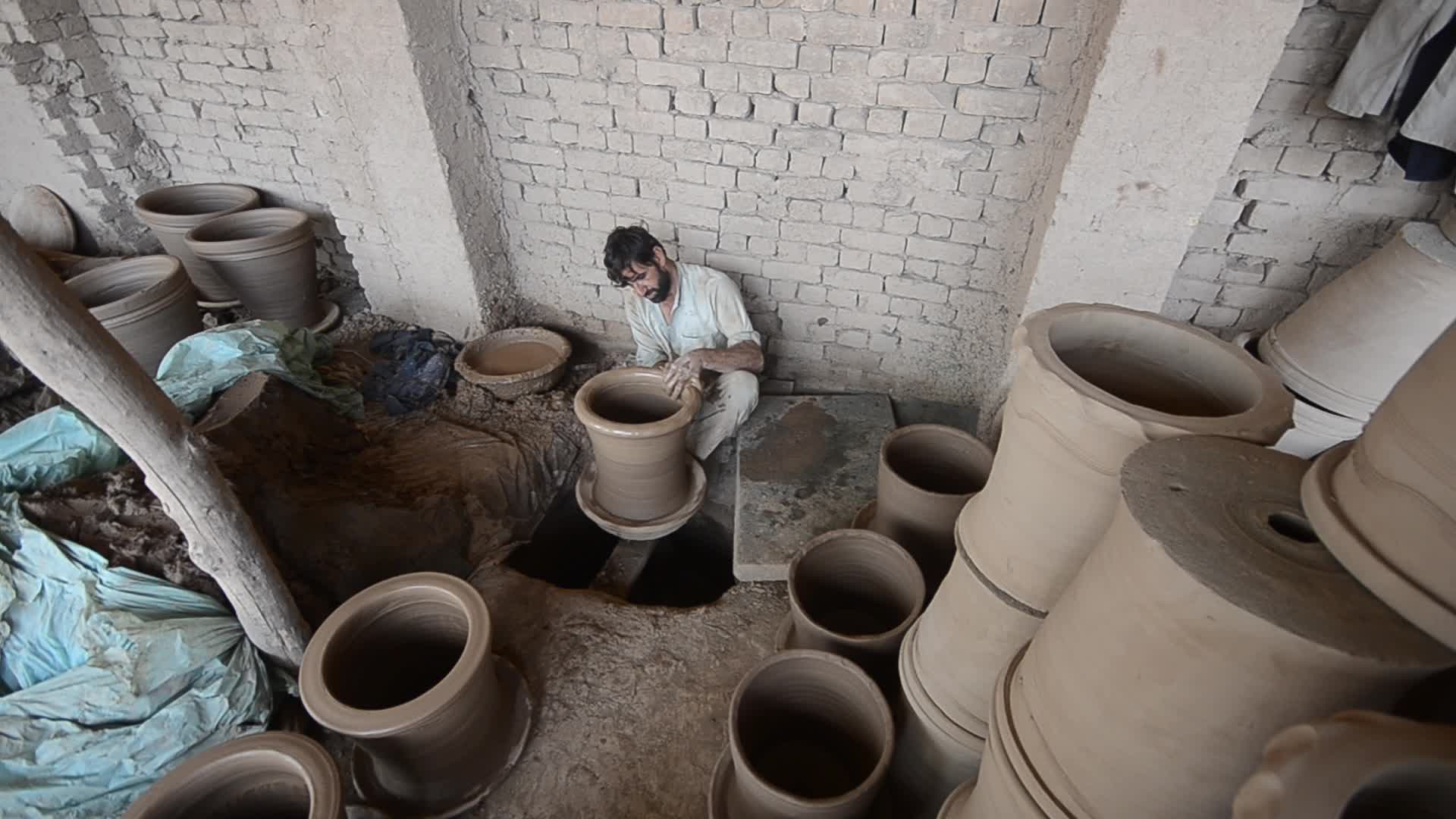 Laborers work on the eve of World Labor Day in Peshawar 