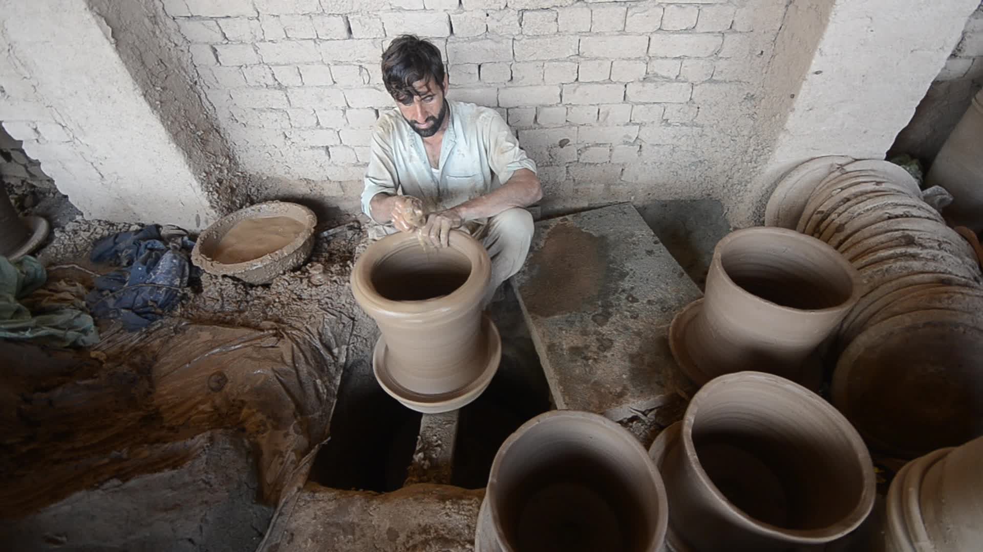 Laborers work on the eve of World Labor Day in Peshawar 