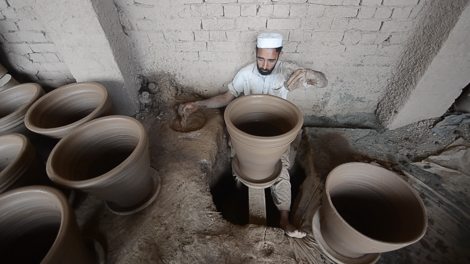 Laborers work on the eve of World Labor Day in Peshawar 