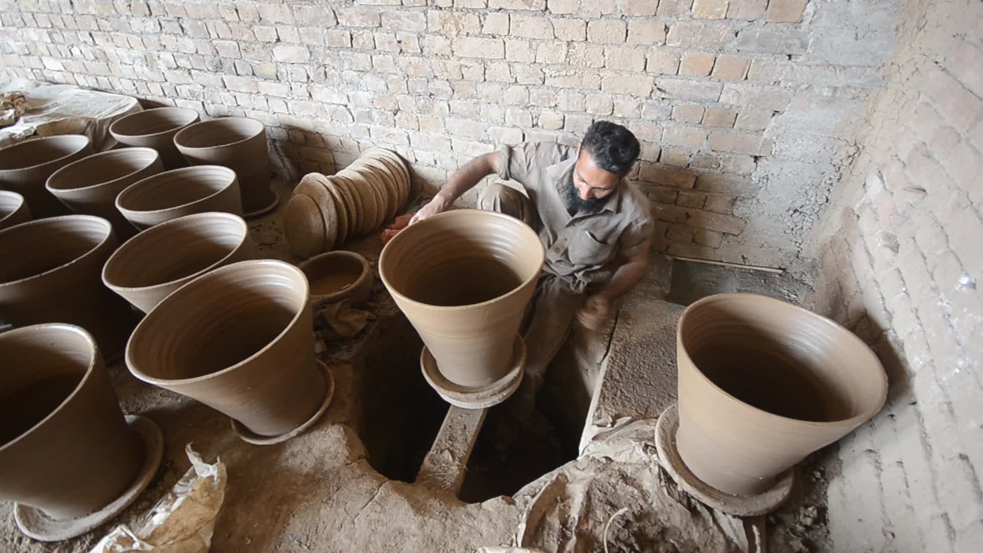 Laborers work on the eve of World Labor Day in Peshawar 