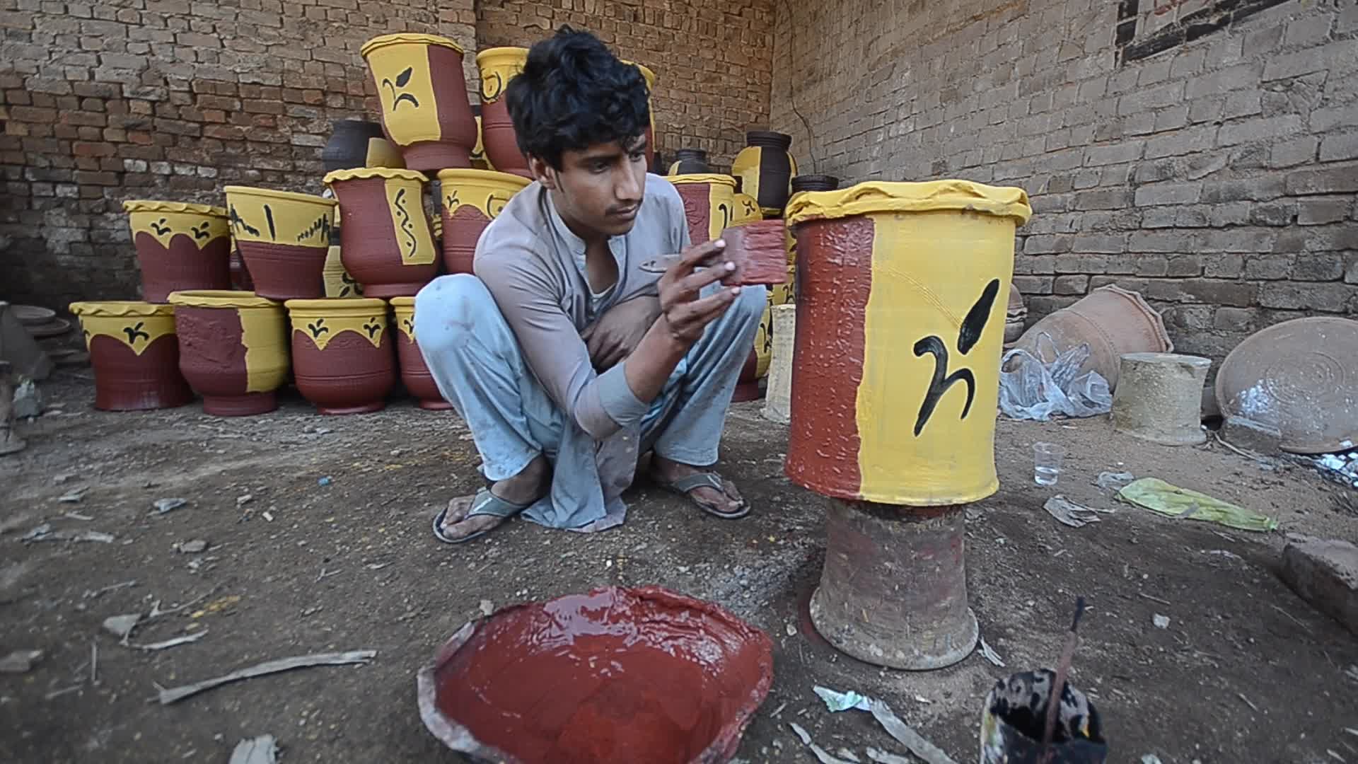 Laborers work on the eve of World Labor Day in Peshawar 