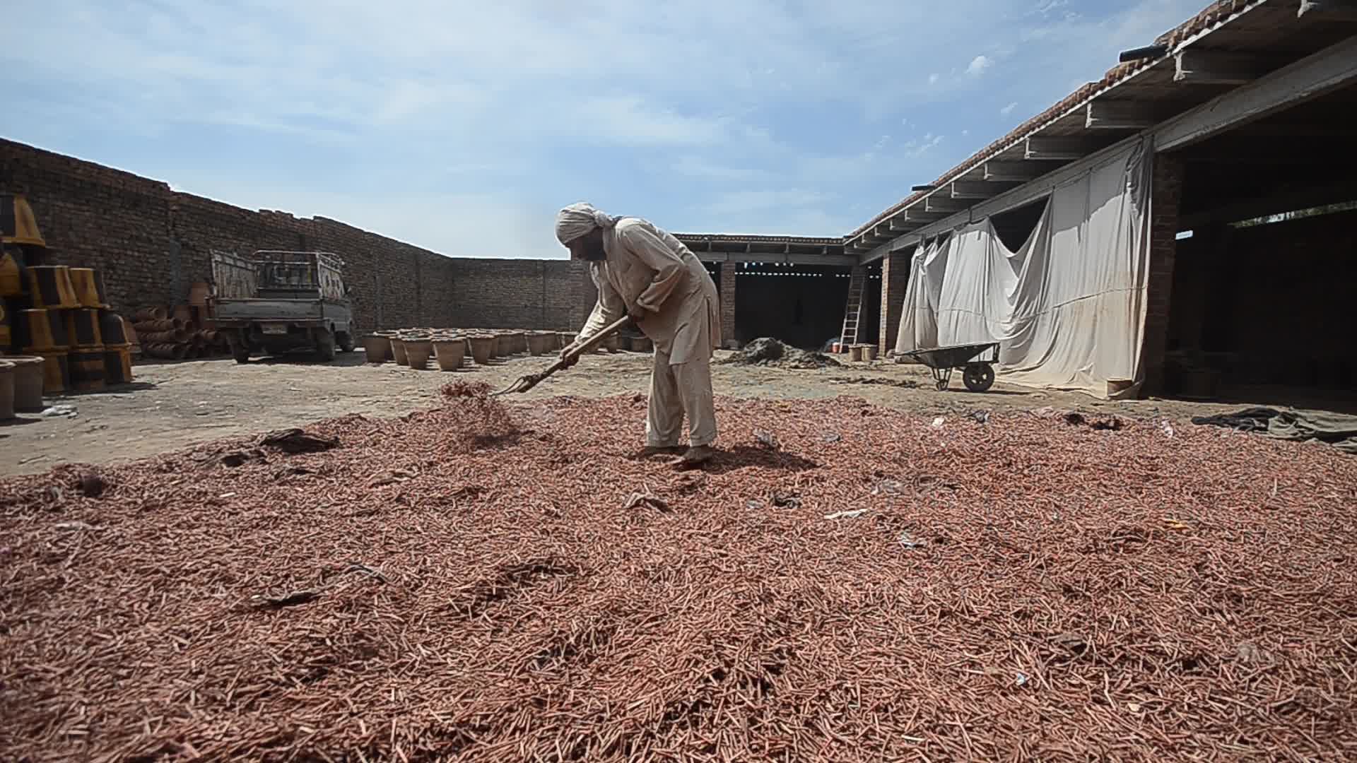 Laborers work on the eve of World Labor Day in Peshawar 