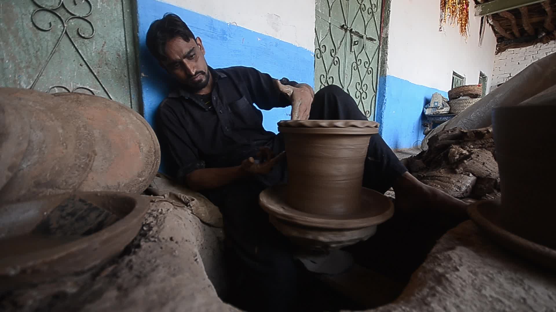 Laborers work on the eve of World Labor Day in Peshawar 