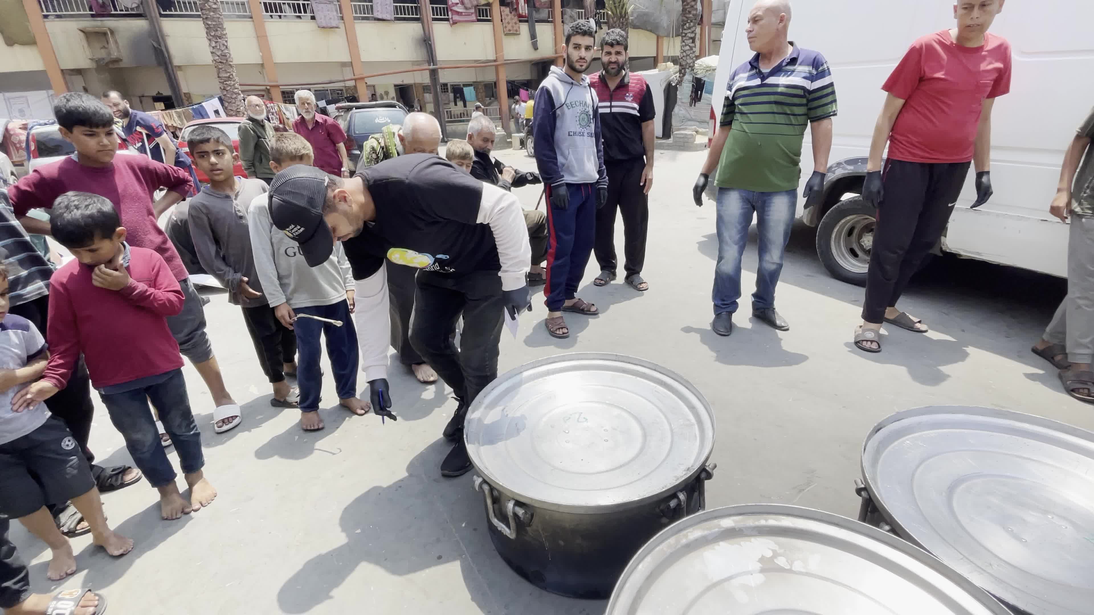World Central Kitchen Aid Worker Serves Meals to Palestinians Amid Hamas-Israel Conflict