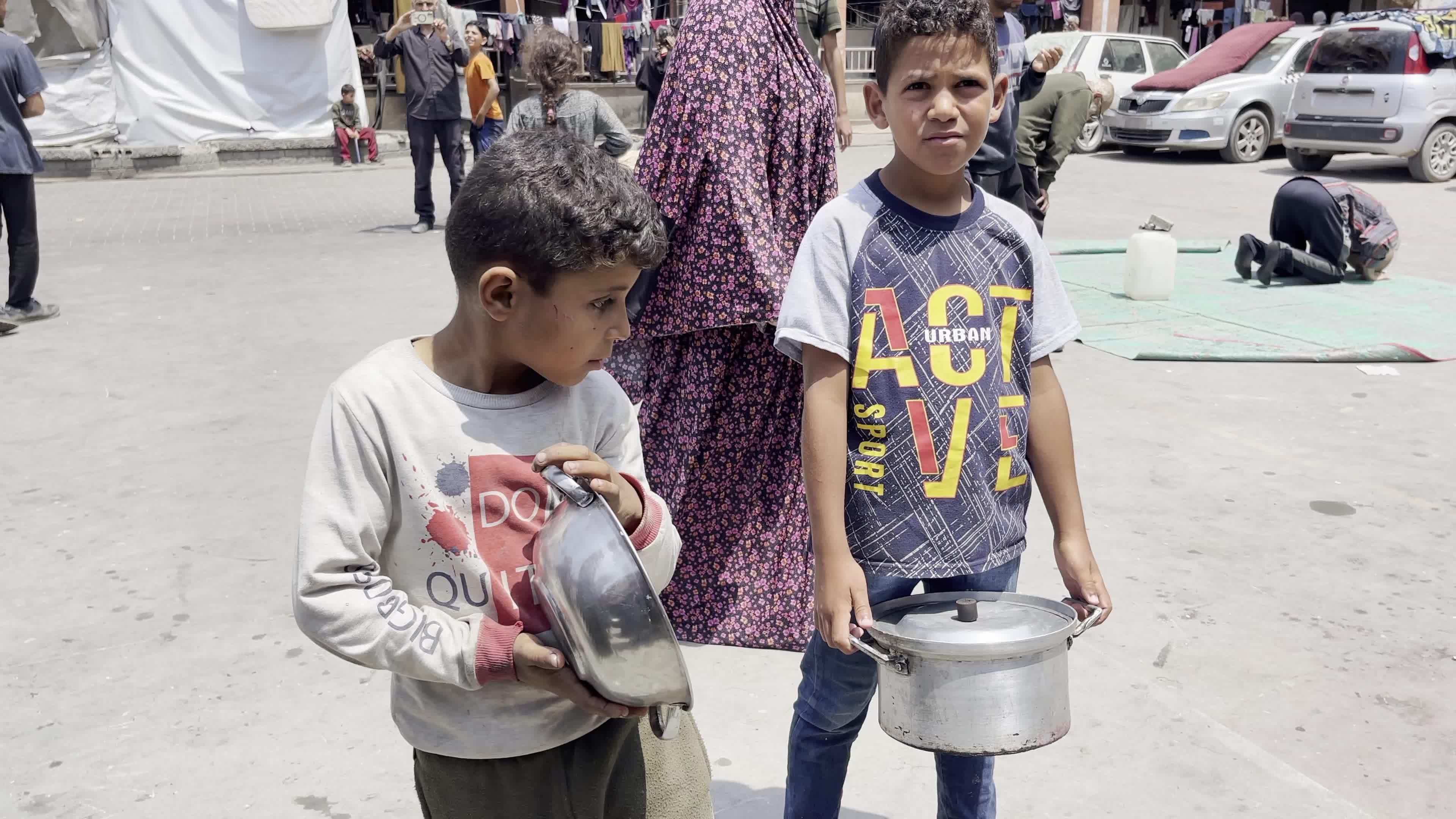 World Central Kitchen Aid Worker Serves Meals to Palestinians Amid Hamas-Israel Conflict