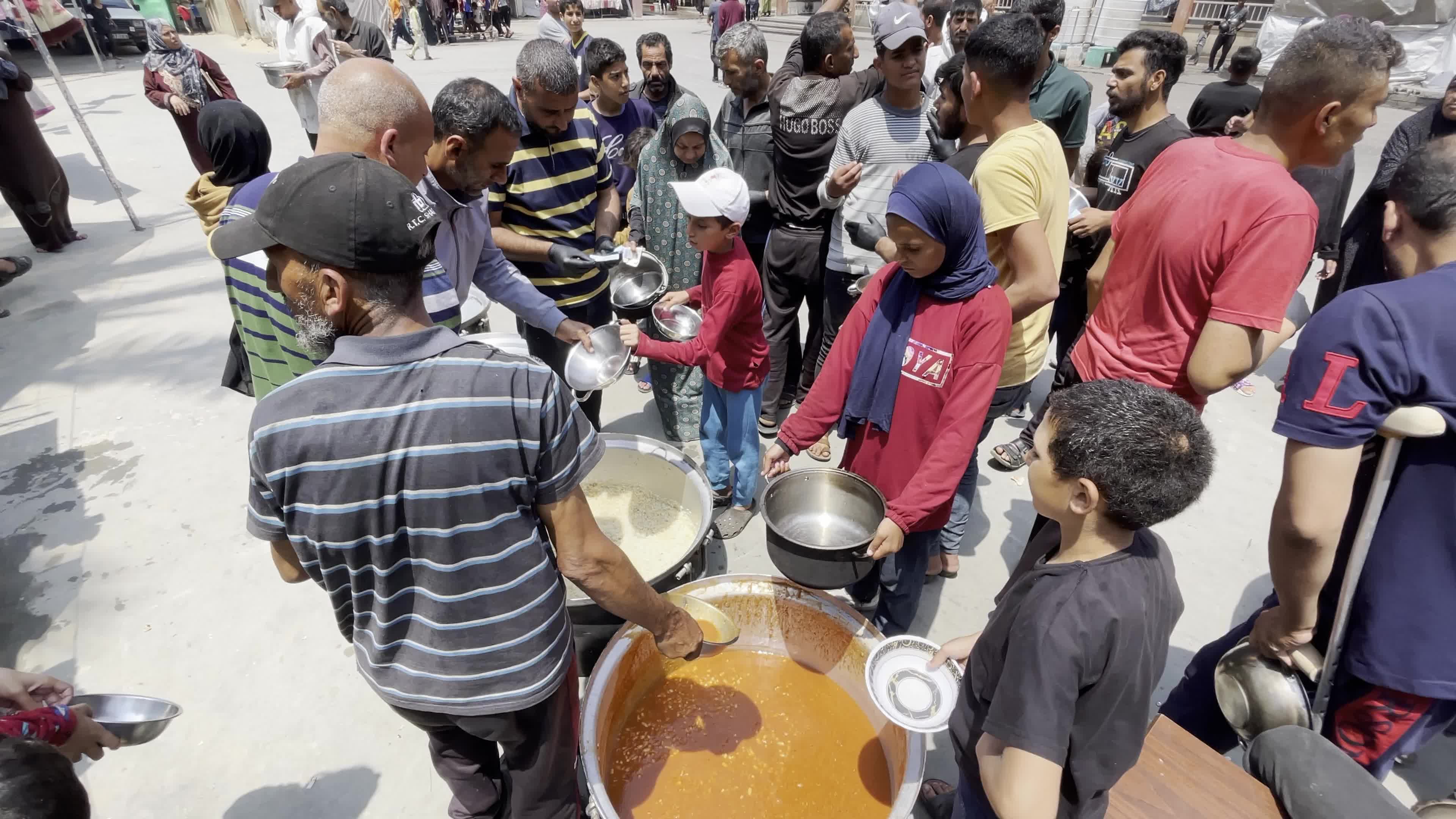 World Central Kitchen Aid Worker Serves Meals to Palestinians Amid Hamas-Israel Conflict