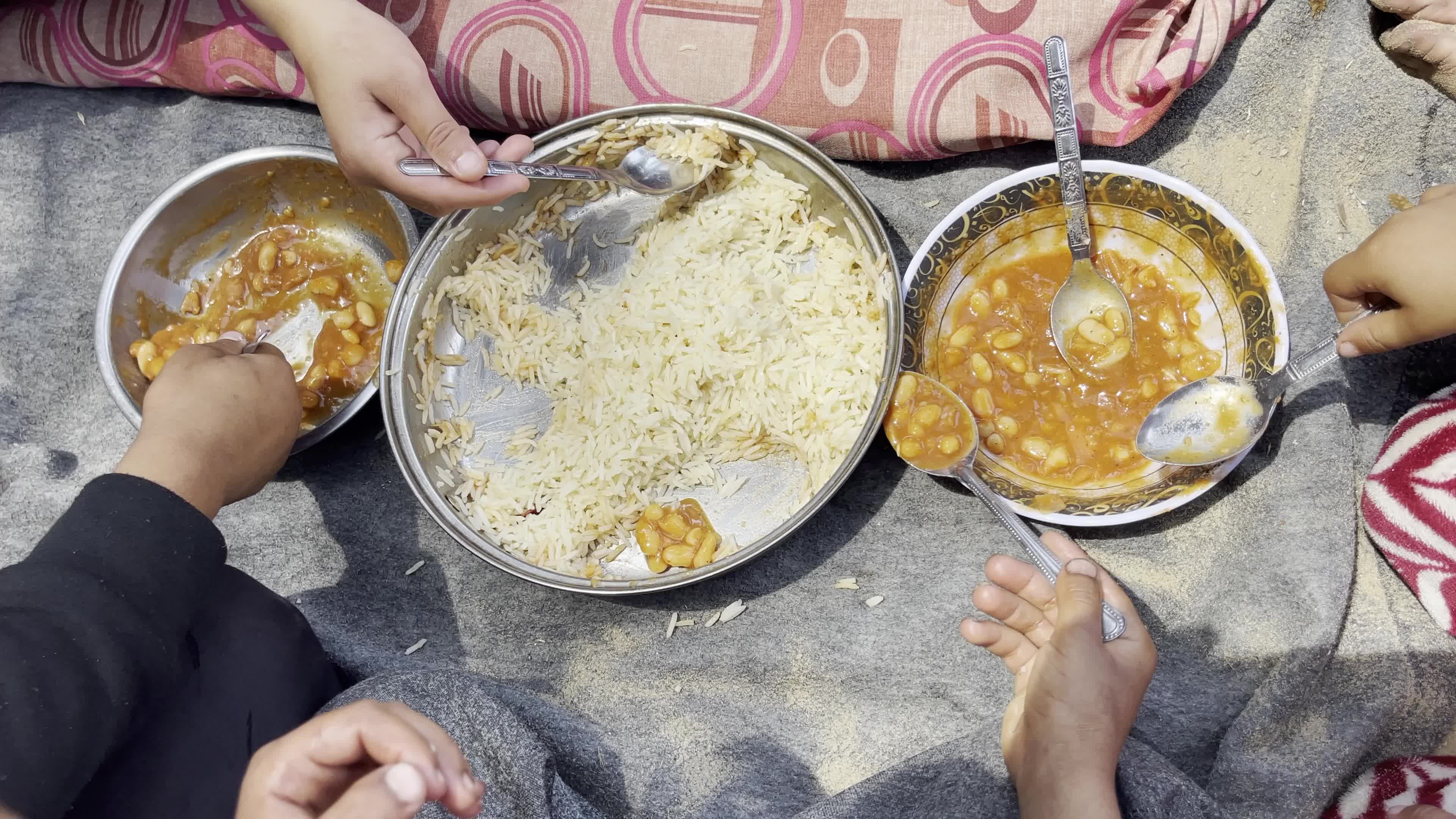 World Central Kitchen Aid Worker Serves Meals to Palestinians Amid Hamas-Israel Conflict