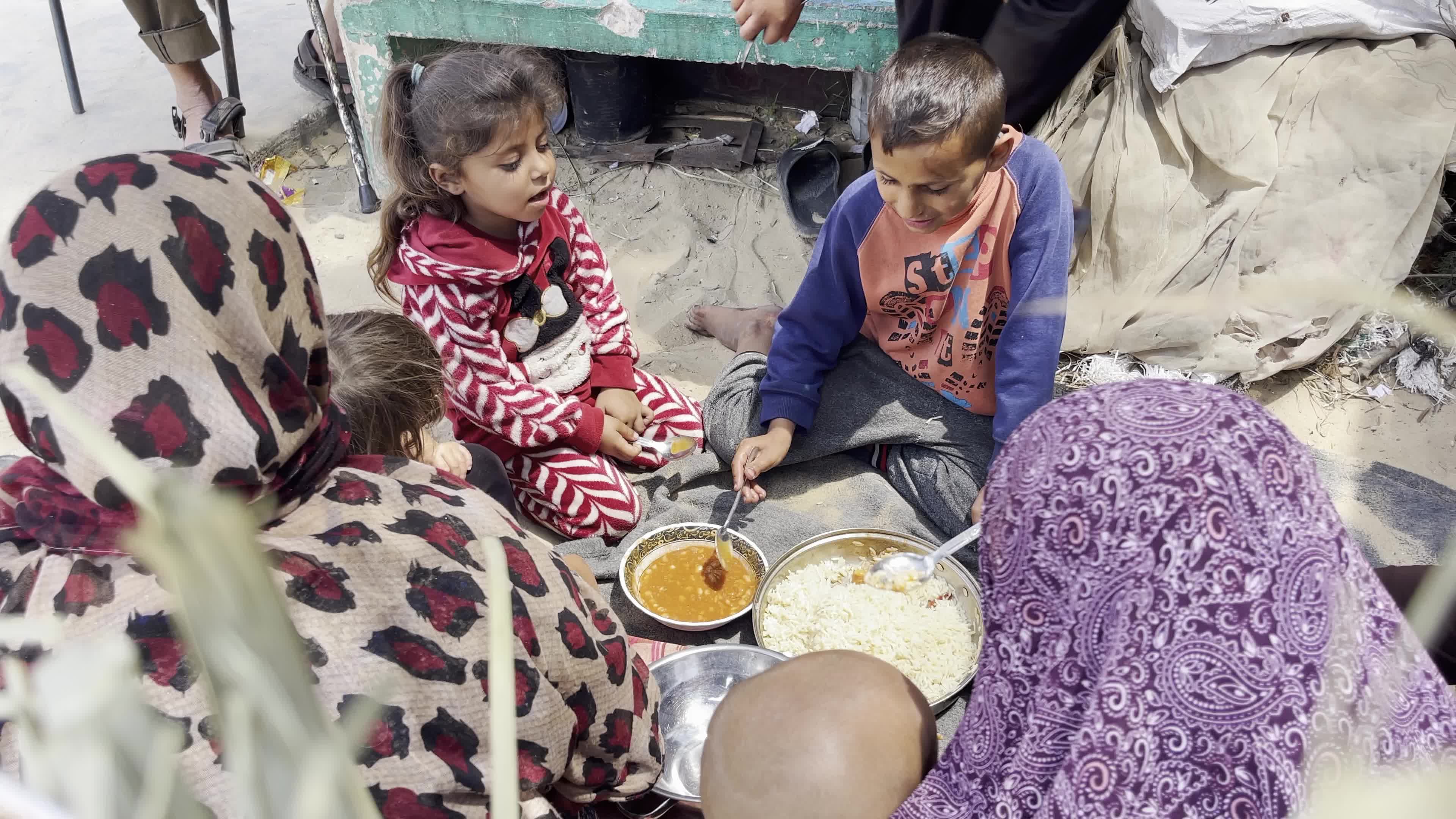 World Central Kitchen Aid Worker Serves Meals to Palestinians Amid Hamas-Israel Conflict