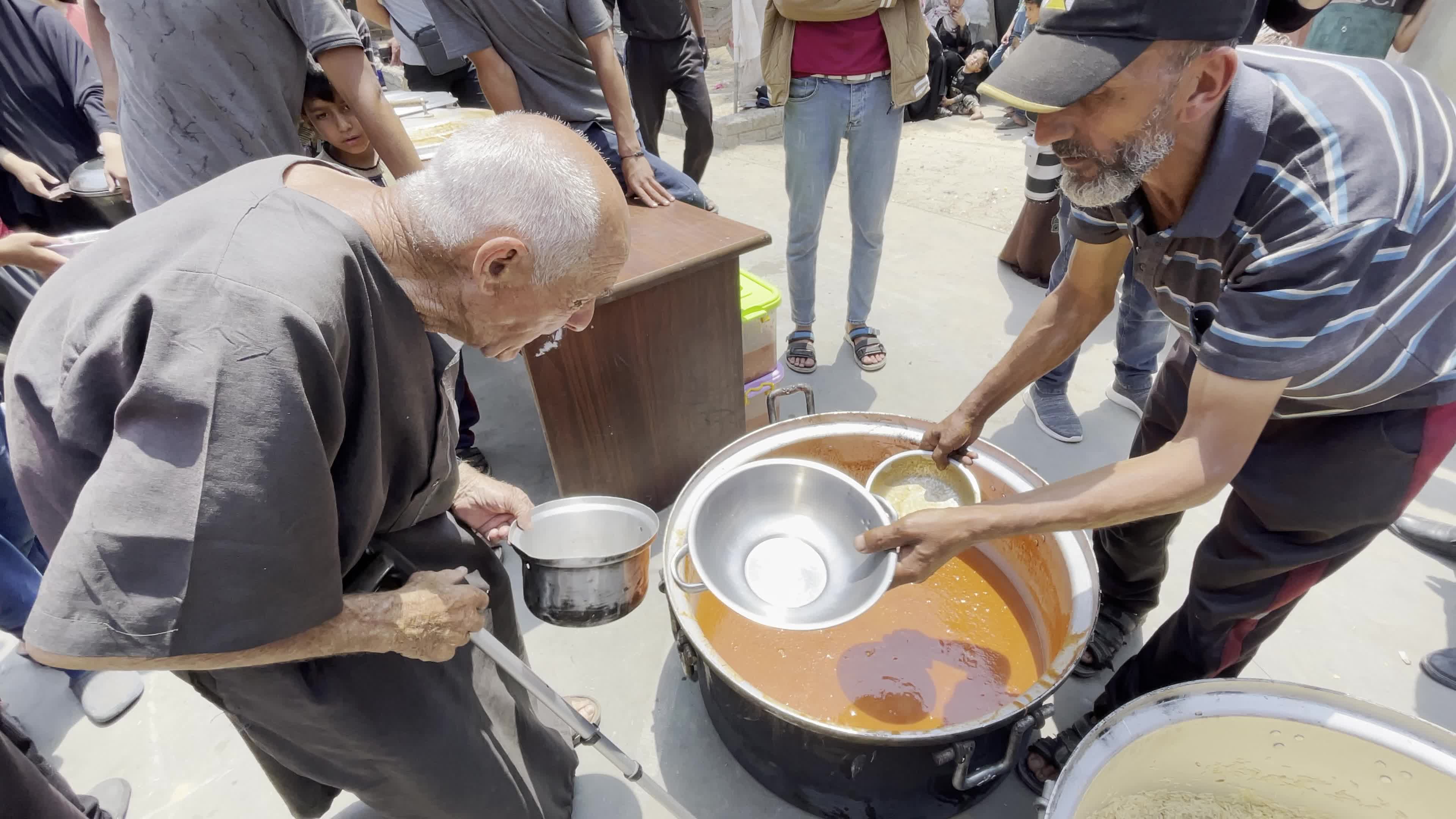 World Central Kitchen Aid Worker Serves Meals to Palestinians Amid Hamas-Israel Conflict