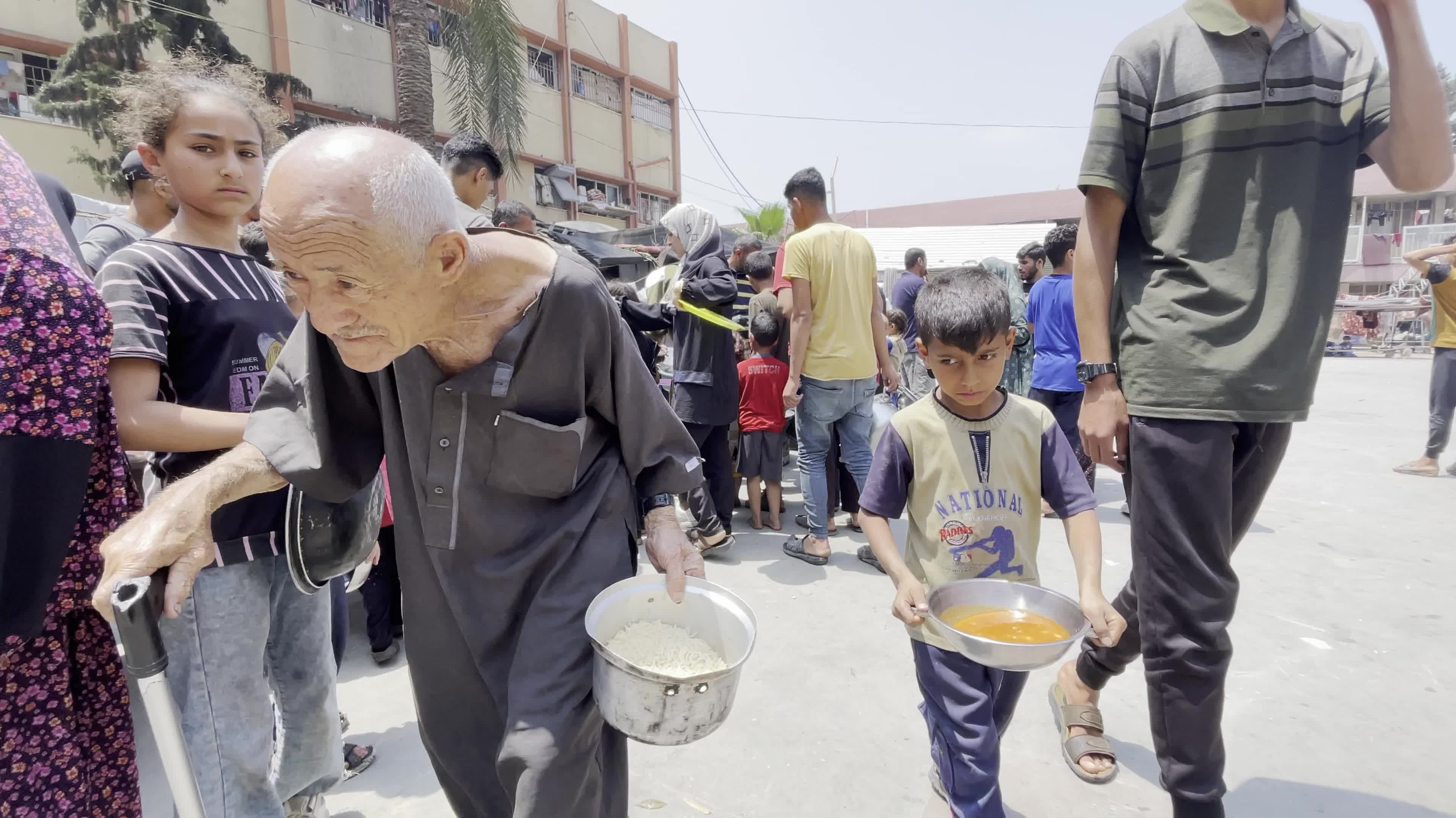 World Central Kitchen Aid Worker Serves Meals to Palestinians Amid Hamas-Israel Conflict