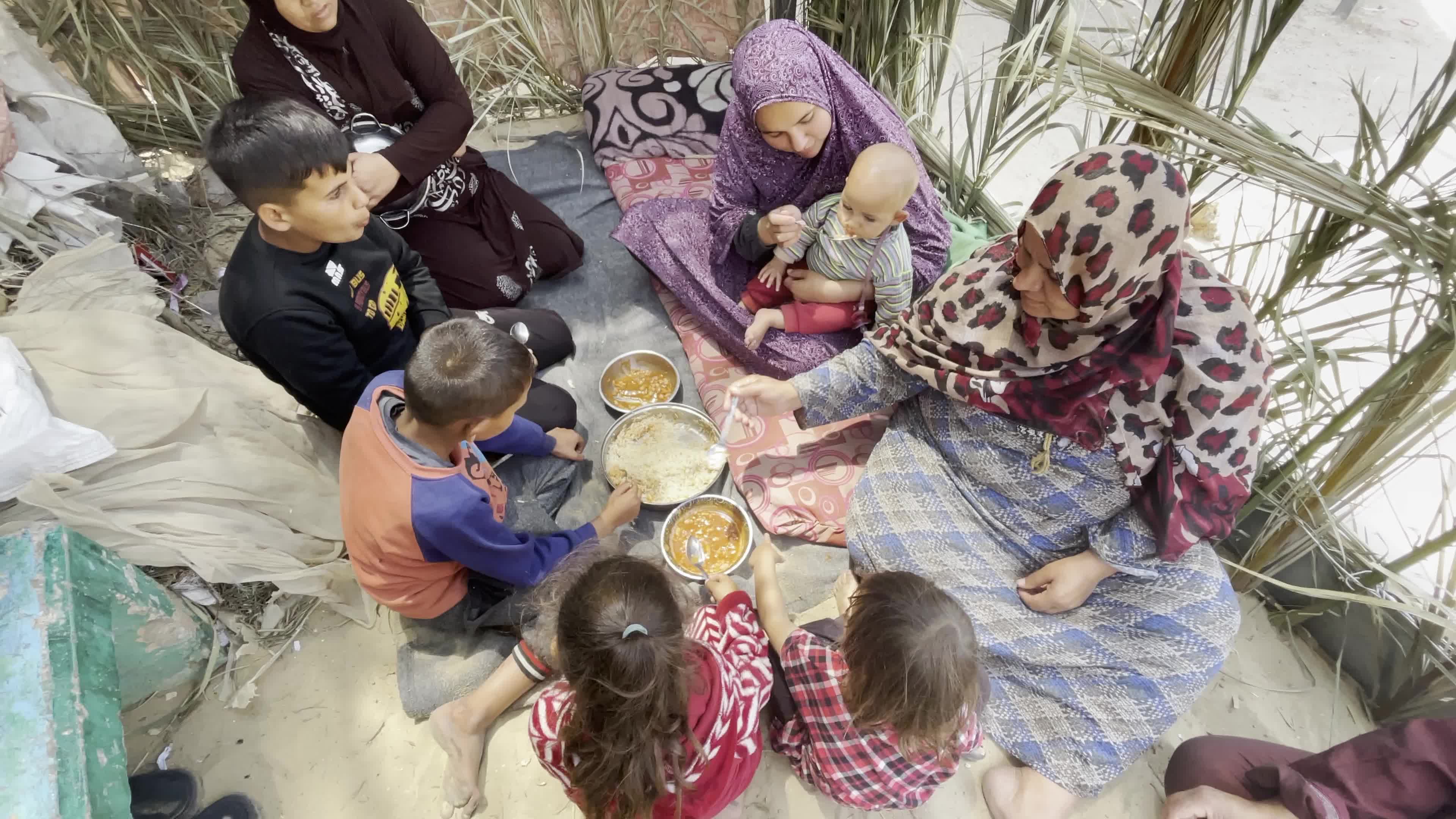 World Central Kitchen Aid Worker Serves Meals to Palestinians Amid Hamas-Israel Conflict