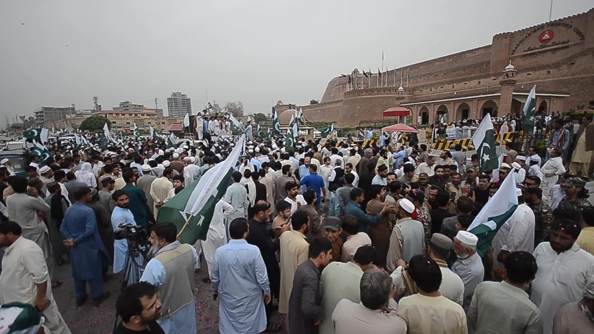 People attend a rally to mark the first anniversary of May 2023 riots, in Peshawar 