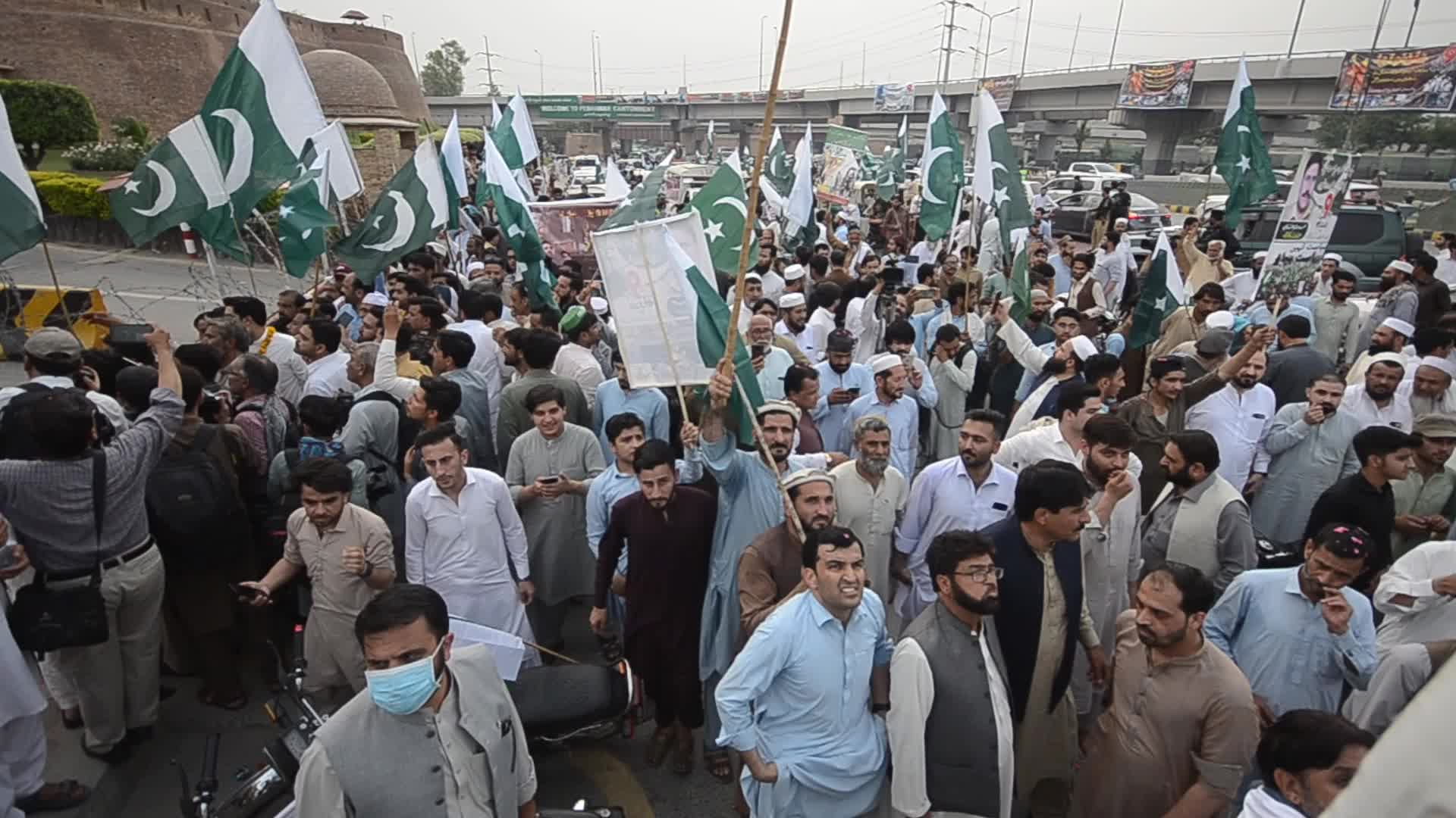People attend a rally to mark the first anniversary of May 2023 riots, in Peshawar 