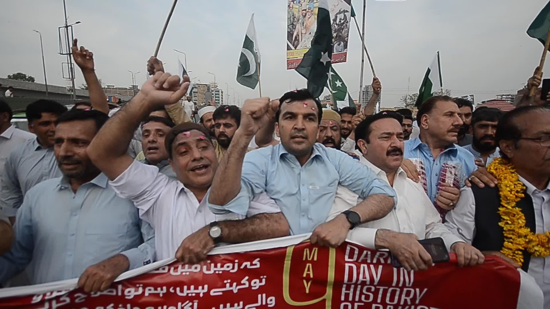 People attend a rally to mark the first anniversary of May 2023 riots, in Peshawar 