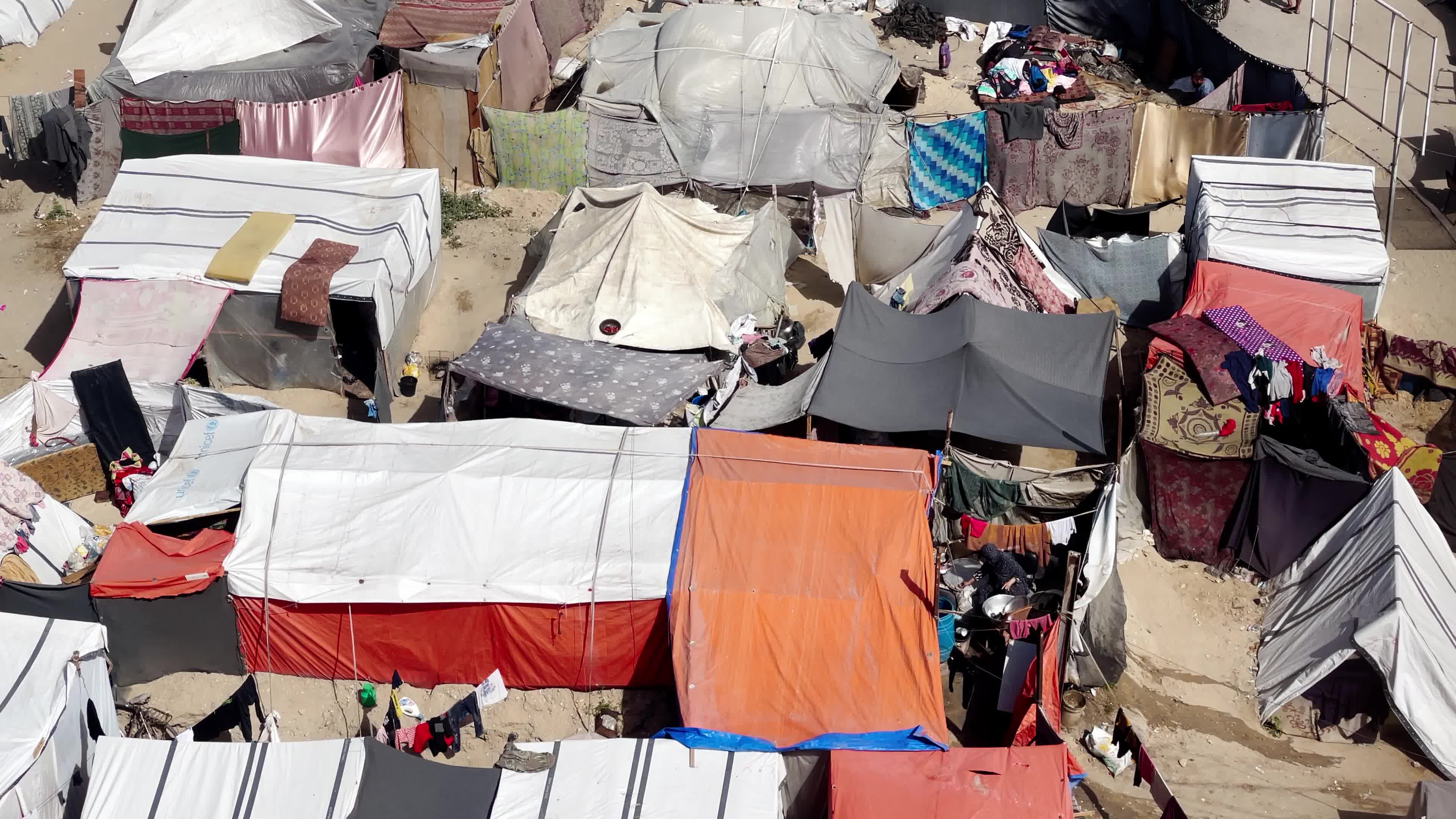 Internally Displaced Palestinians Shelter at Deir el-Balah Shore Amid Ongoing Gaza Conflict"