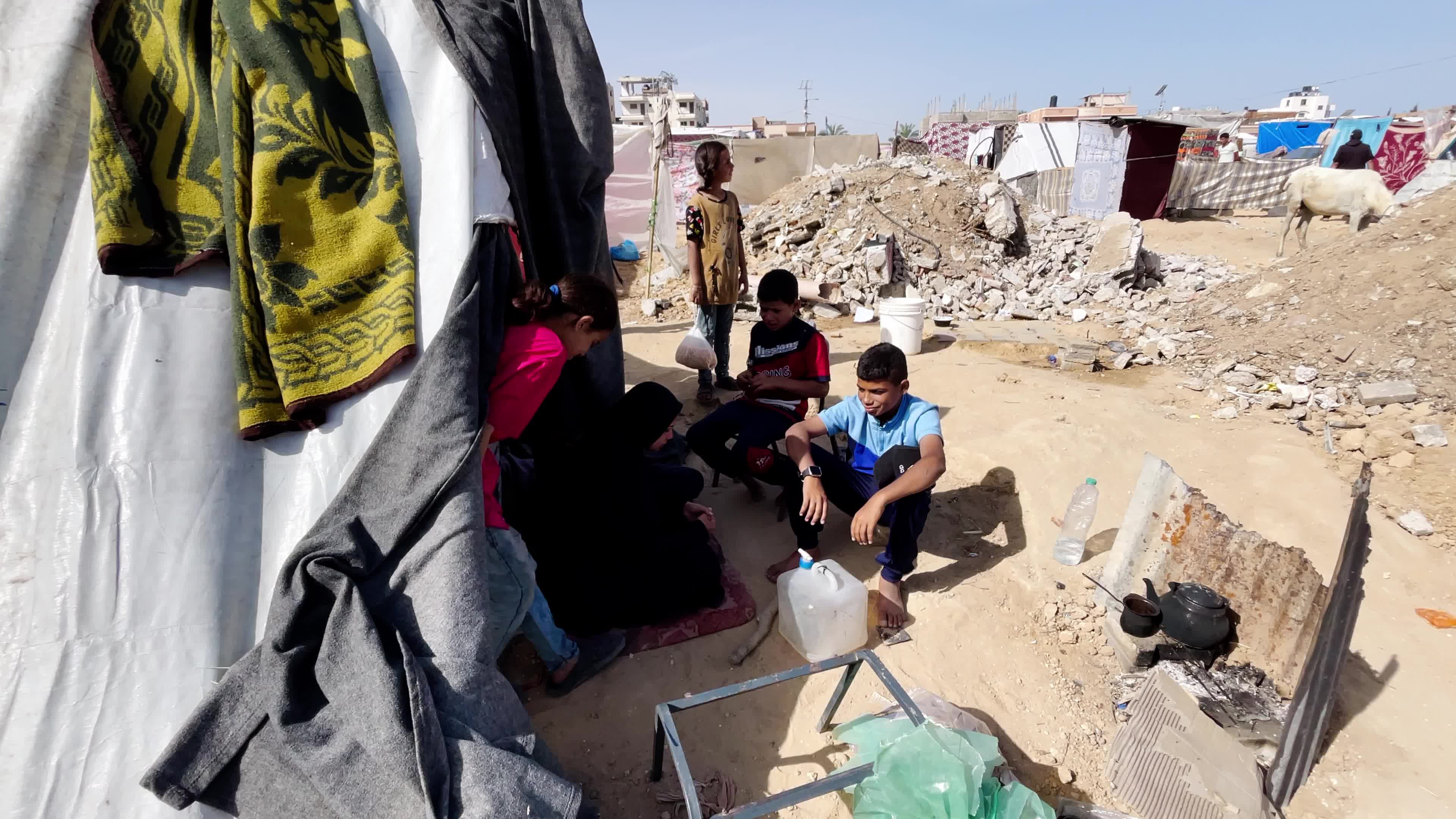 Internally Displaced Palestinians Shelter at Deir el-Balah Shore Amid Ongoing Gaza Conflict"
