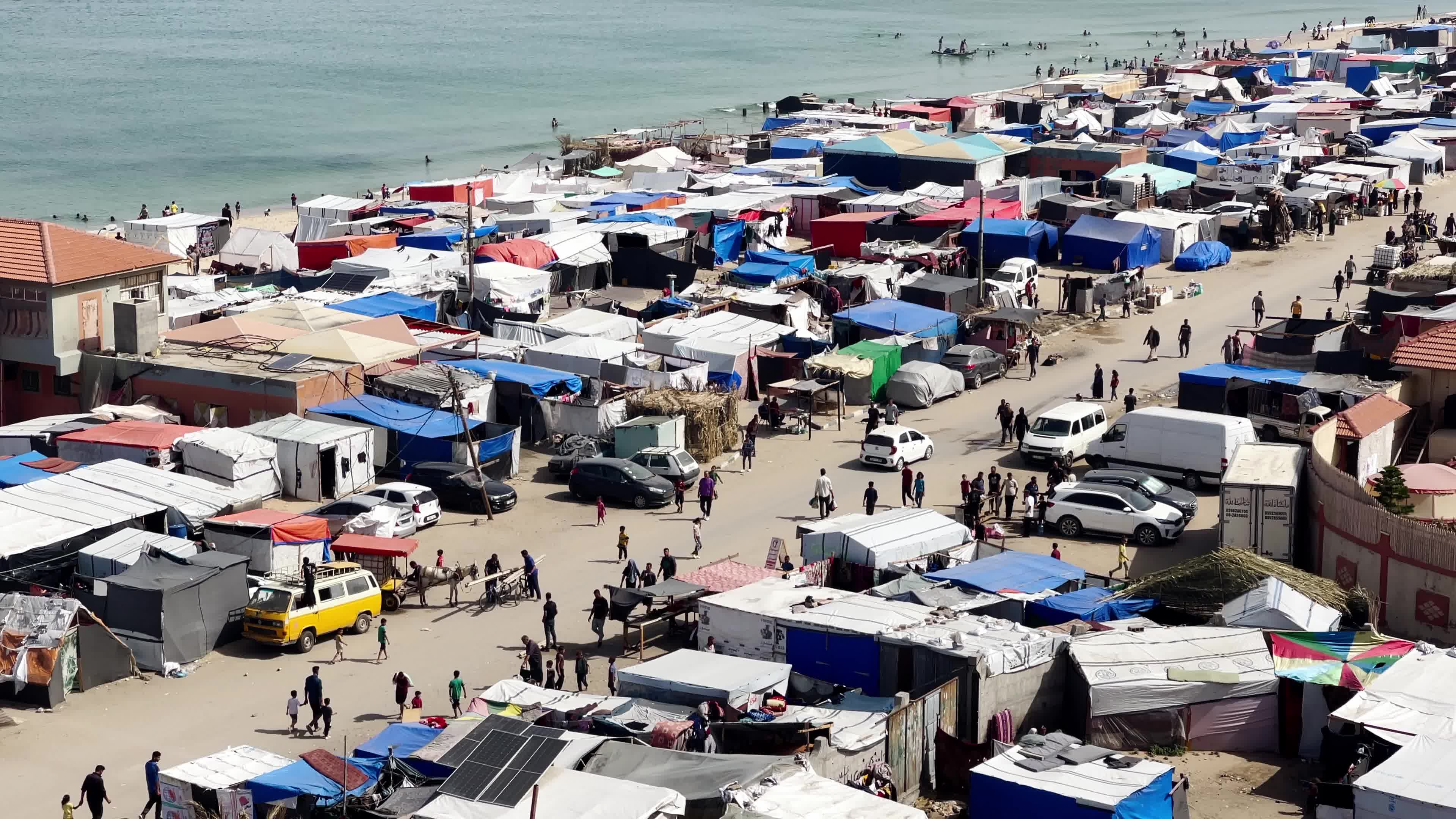 Internally Displaced Palestinians Shelter at Deir el-Balah Shore Amid Ongoing Gaza Conflict"