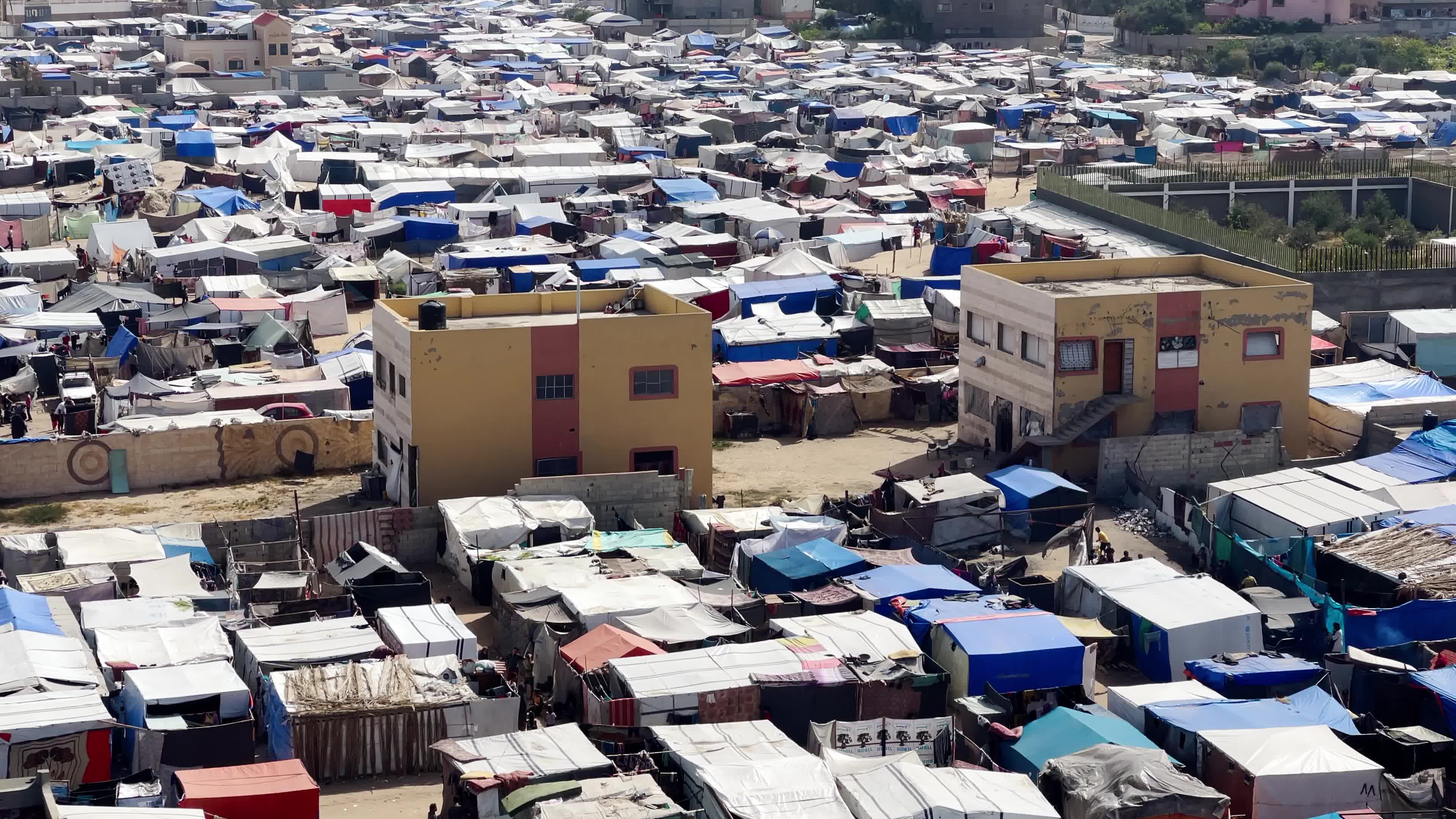 Internally Displaced Palestinians Shelter at Deir el-Balah Shore Amid Ongoing Gaza Conflict"
