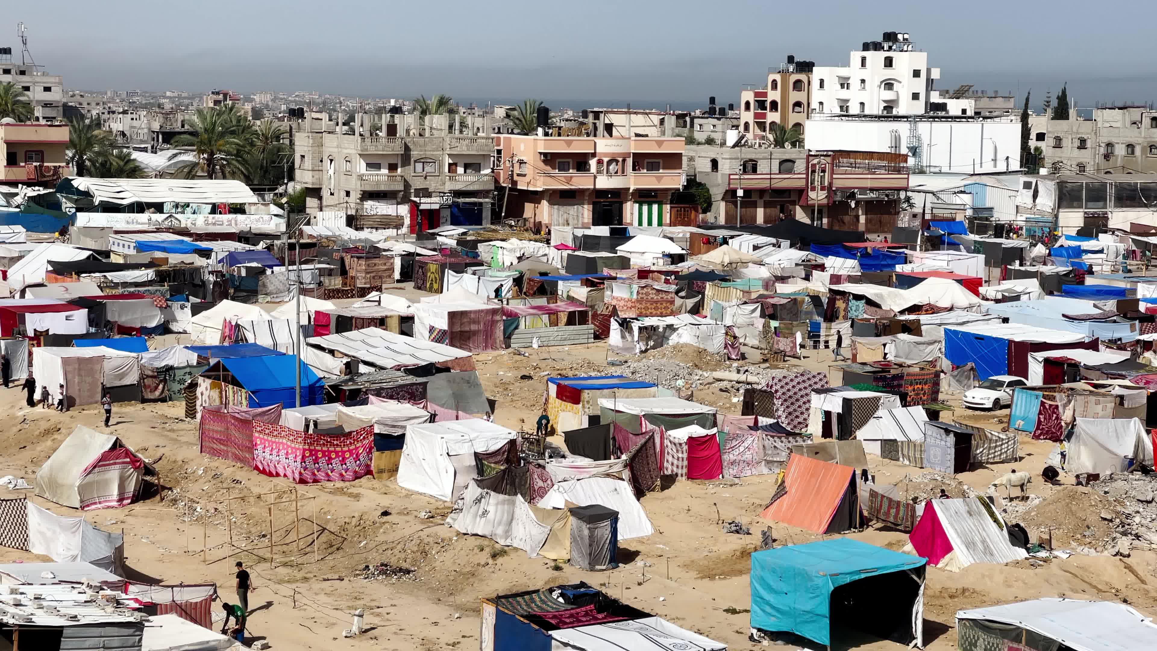 Internally Displaced Palestinians Shelter at Deir el-Balah Shore Amid Ongoing Gaza Conflict"