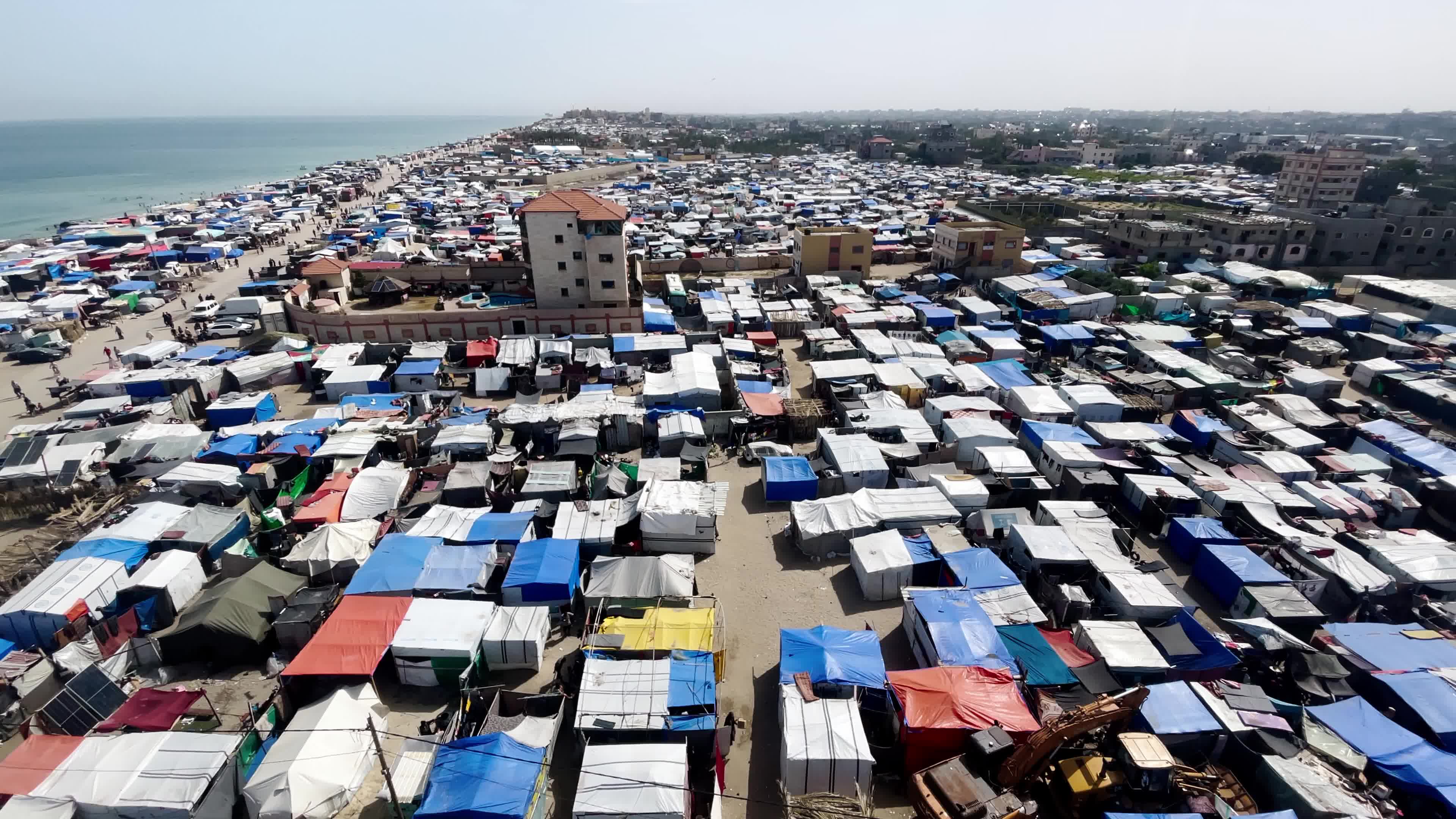 Internally Displaced Palestinians Shelter at Deir el-Balah Shore Amid Ongoing Gaza Conflict"