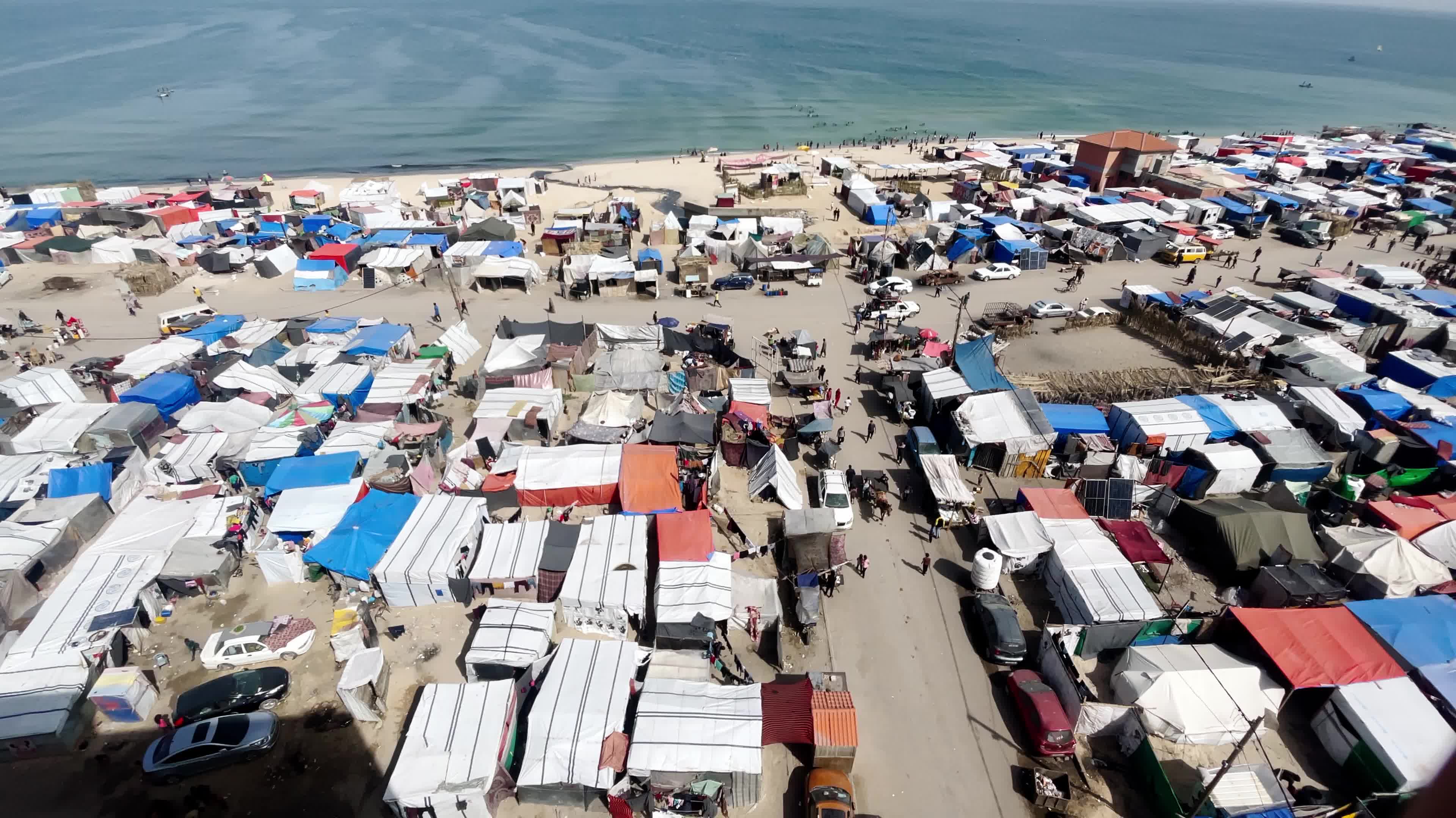 Internally Displaced Palestinians Shelter at Deir el-Balah Shore Amid Ongoing Gaza Conflict"