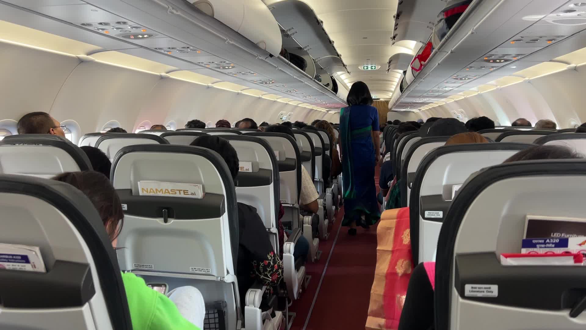 Passengers aboard an Air India airplane