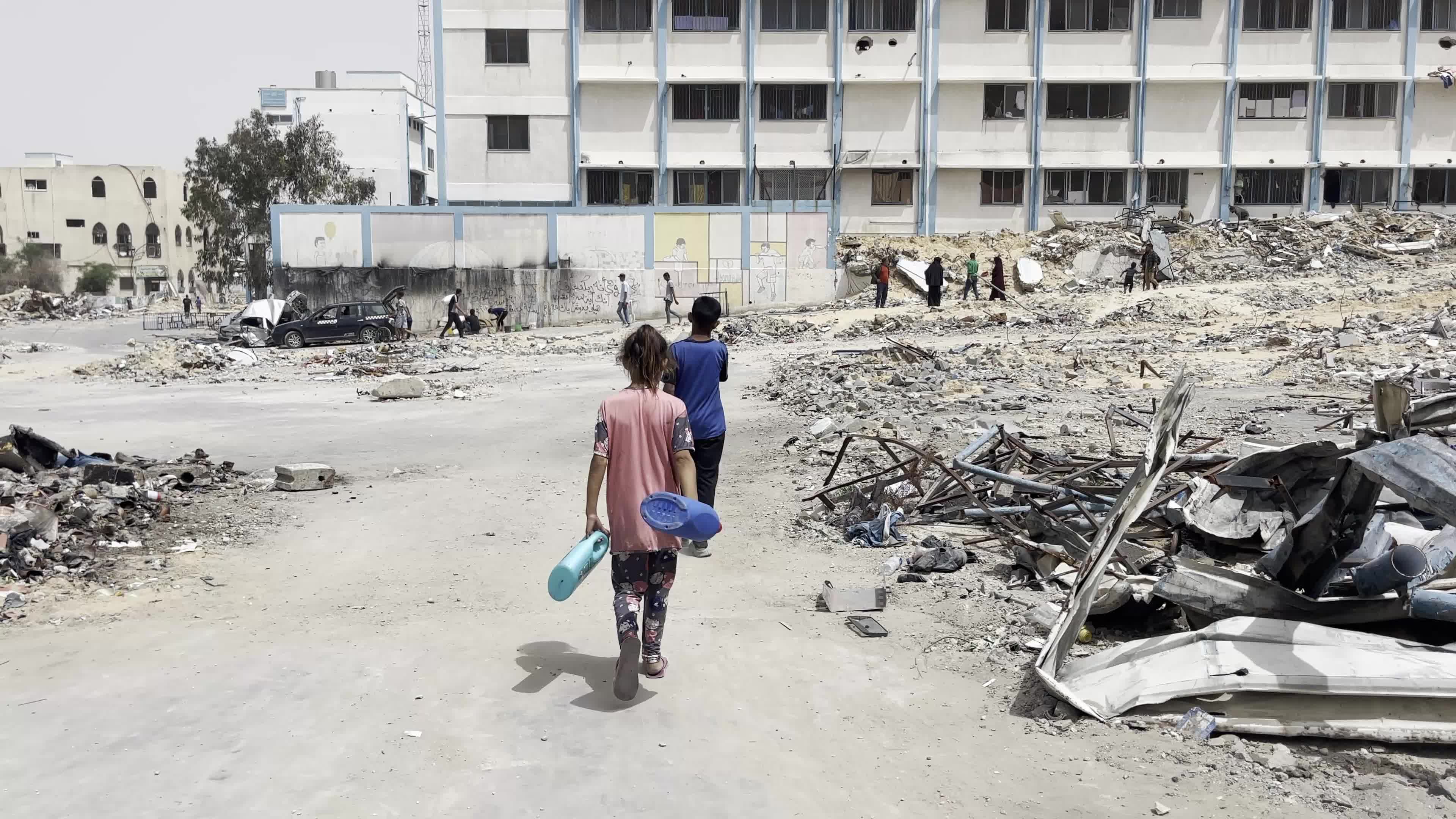 Displaced Palestinians Seek Refuge in Khan Yunis School Amid Hamas-Israel Conflict