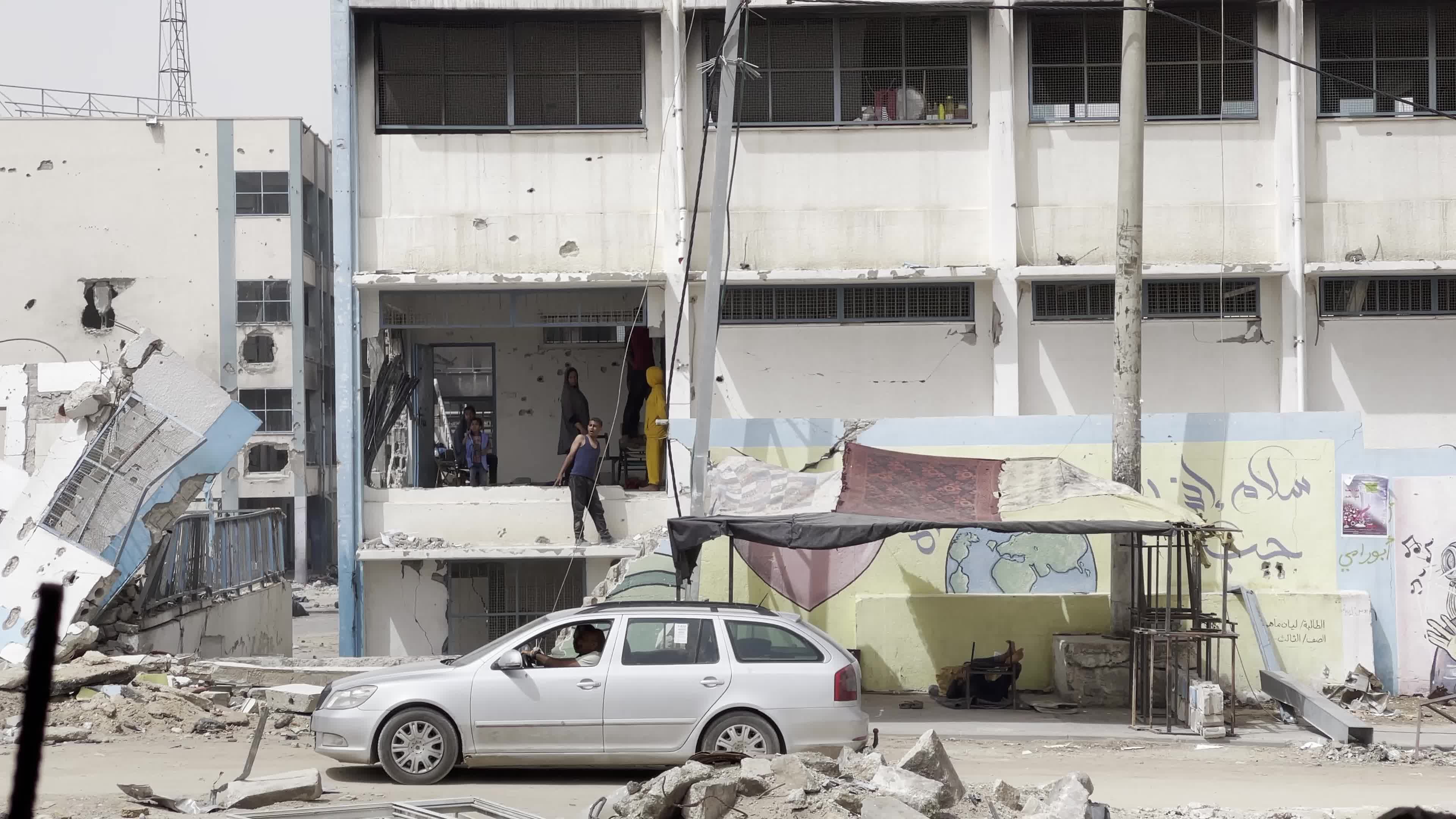 Displaced Palestinians Seek Refuge in Khan Yunis School Amid Hamas-Israel Conflict