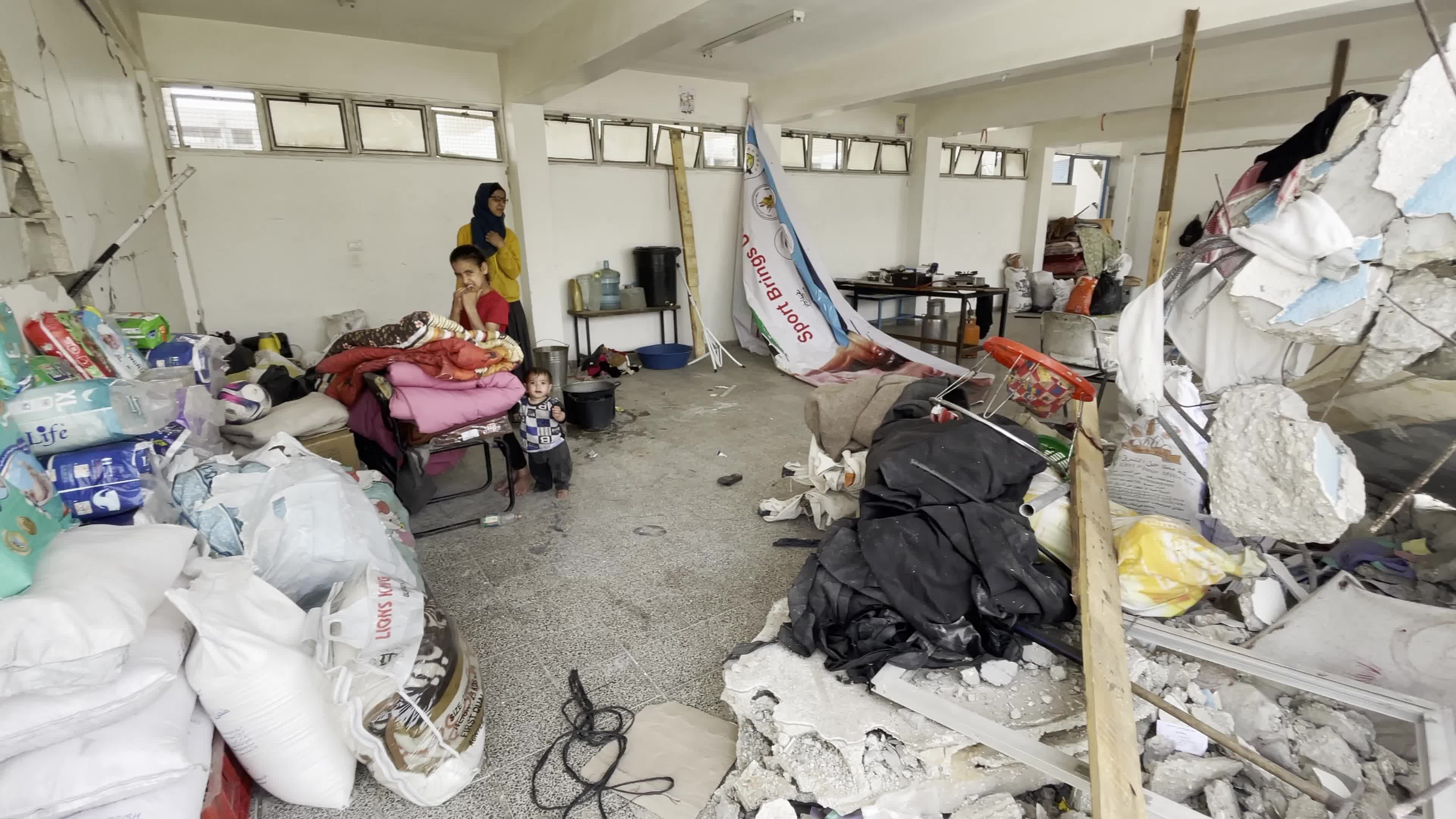 Displaced Palestinians Seek Refuge in Khan Yunis School Amid Hamas-Israel Conflict
