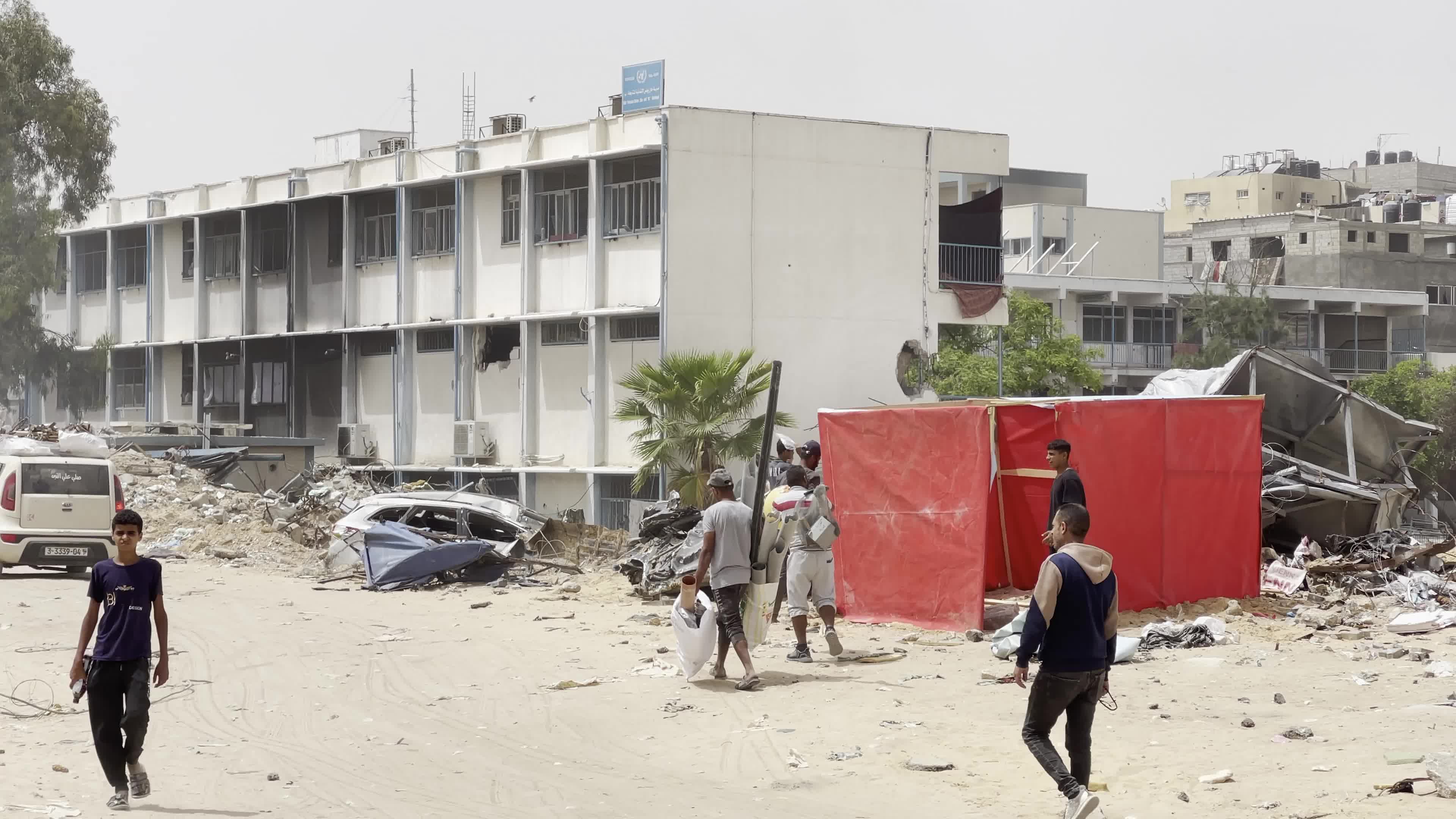 Displaced Palestinians Seek Refuge in Khan Yunis School Amid Hamas-Israel Conflict