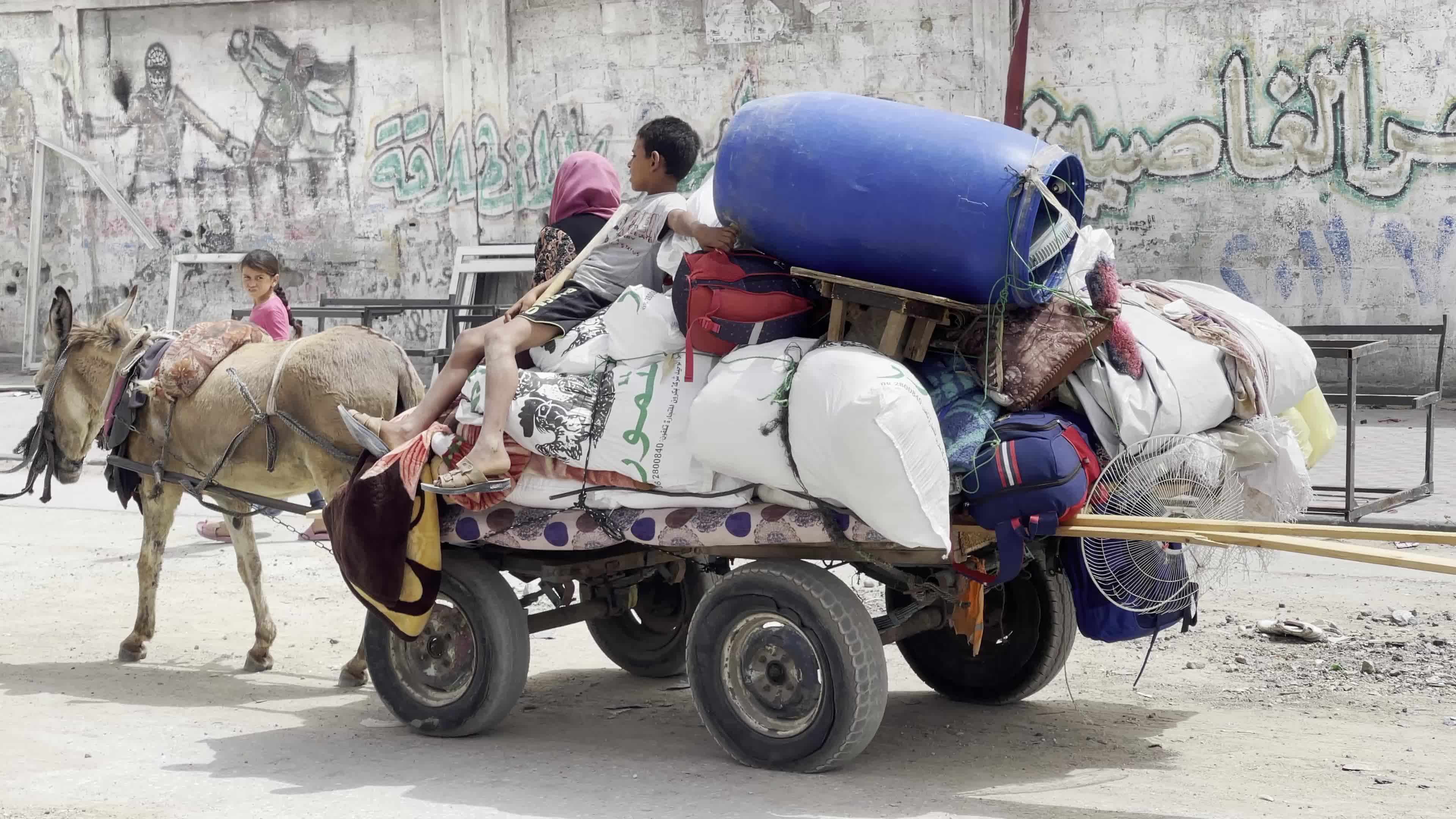 Displaced Palestinians Seek Refuge in Khan Yunis School Amid Hamas-Israel Conflict