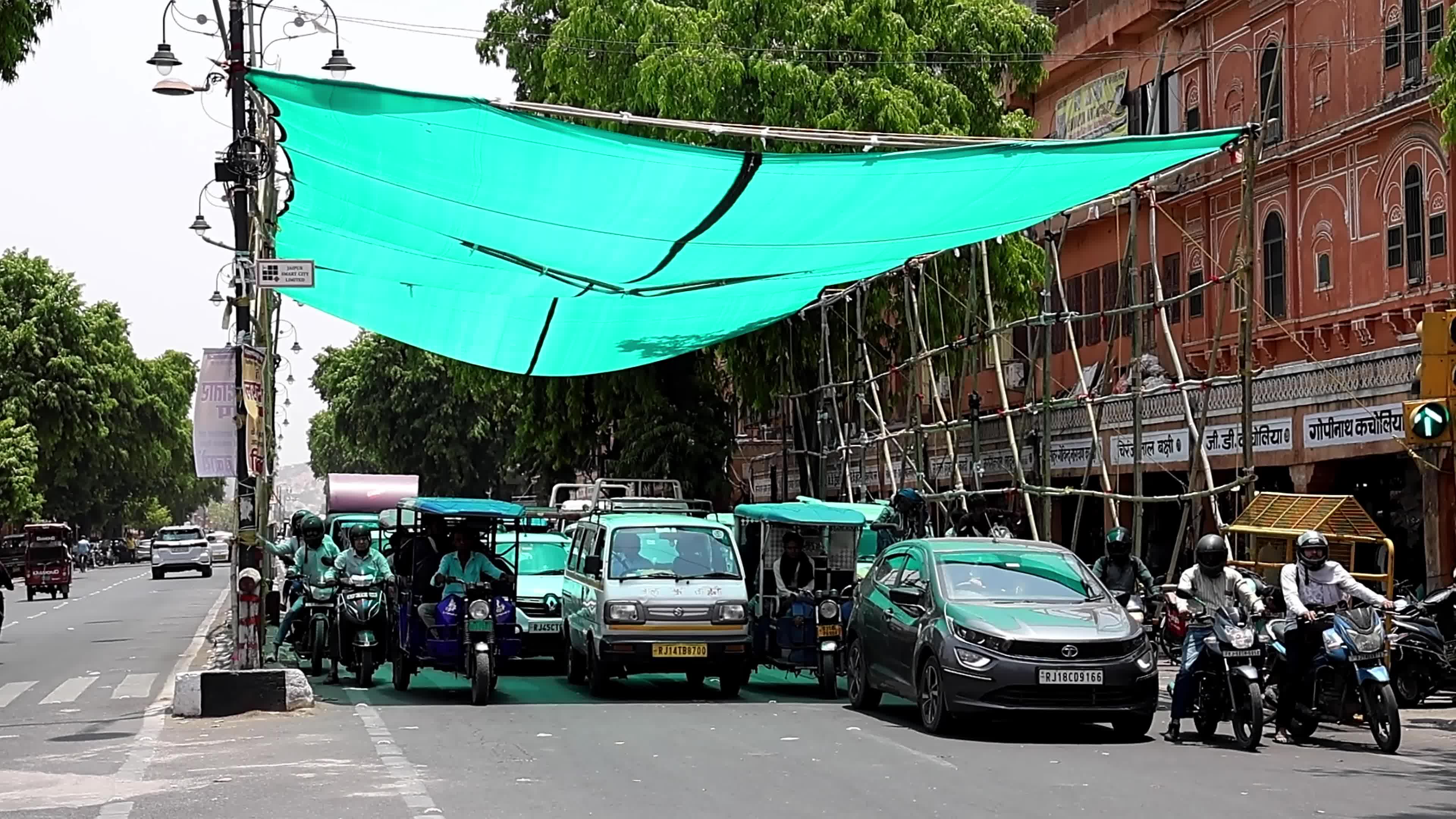 Makeshift Green Shades Tent And Water Mist For Commuters On Hot Summer Day In Jaipur