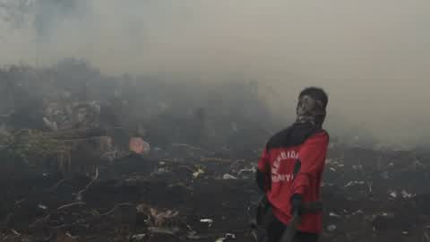 Residents are evacuated due to a forest fire in Riau, Indonesia