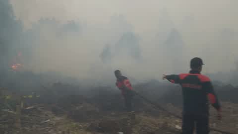 Residents are evacuated due to a forest fire in Riau, Indonesia