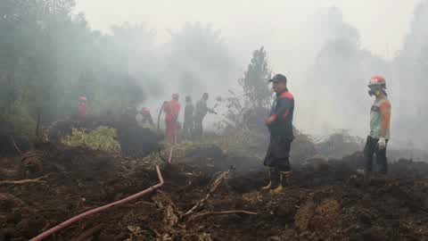 Residents are evacuated due to a forest fire in Riau, Indonesia