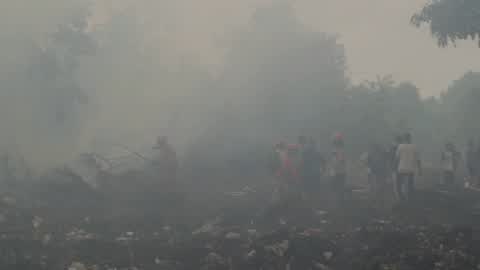 Residents are evacuated due to a forest fire in Riau, Indonesia
