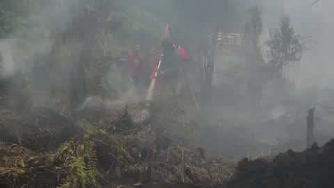 Residents are evacuated due to a forest fire in Riau, Indonesia