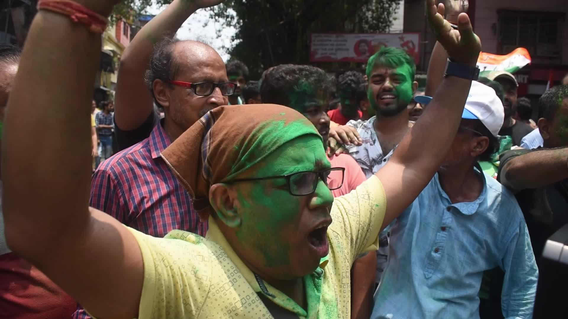 Trinamool Congress party (TMC) members cheer during Lok Sabha Election Result In Kolkata, India