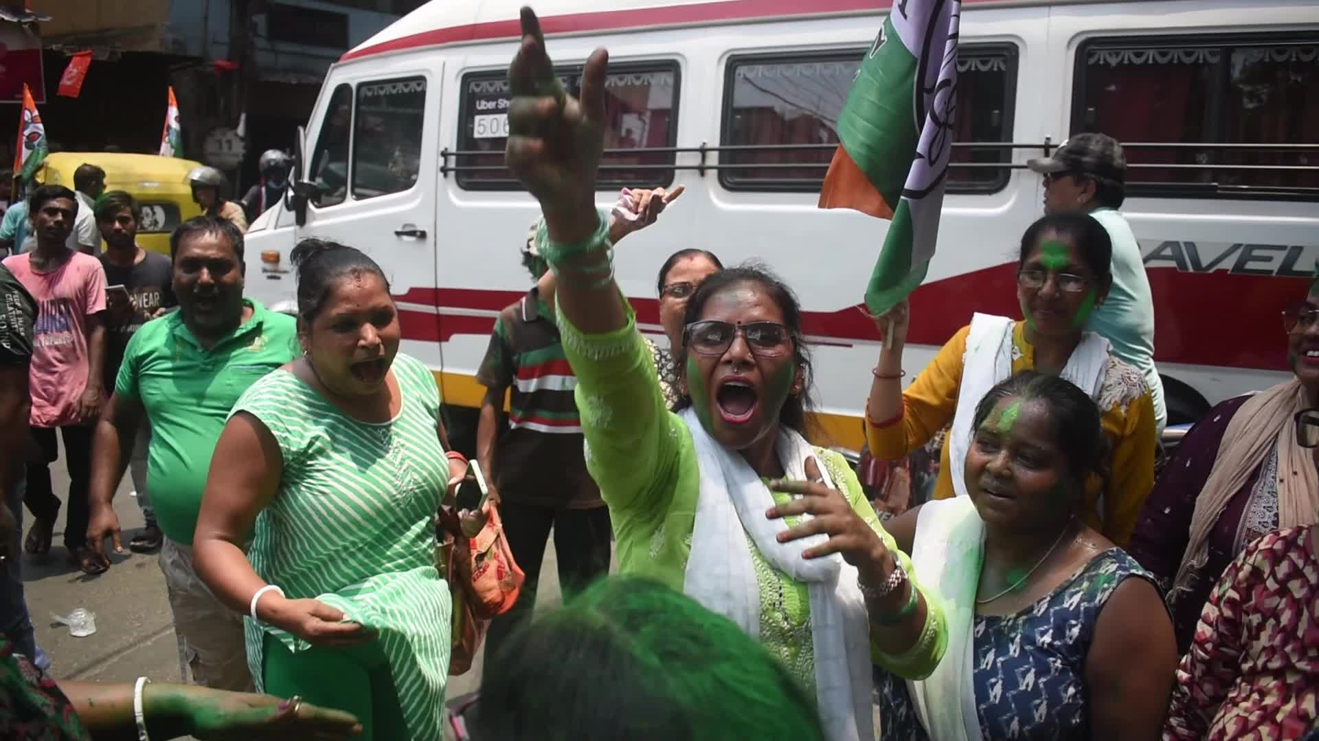 Trinamool Congress party (TMC) members cheer during Lok Sabha Election Result In Kolkata, India